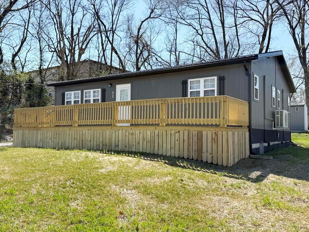 New-Build Home with Truman Lake at Your Fingertips. Built for lifestyle, this 1,008 sq ft home combines comfort and efficiency with modern appeal. Inside, the functional layout is showcased with an open living/dining/kitchen area, plus two bedrooms & one bath. You will find white pine walls & ceilings paired with gray luxury vinyl plank flooring throughout. The impressive kitchen offers oak veneer cabinetry, attractive butcher block countertops, bright lighting & NEW GE stainless steel appliances. Both bedrooms are generously sized with abundant natural light, creating relaxing retreats. Ceiling fans are installed in both bedrooms. The full bathroom is finished with attractive fixtures, quality materials & calming tones, giving a luxury feel.Energy efficiency & long-term sustainability were priorities in construction, shown in upgraded insulation, energy-saving appliances, & systems designed to reduce utility costs. The exterior features durable LP SmartSide® siding & Energy Star-rated windows & doors, including a patio door with built-in shades. A low-maintenance metal roof completes the exterior. Climate control is provided by three electric mini-splits allowing personalized comfort. Insulation includes 1.5–2 inch closed-cell foam for maximum efficiency. An 8'x36’ front deck spans the home, offering great outdoor living space, while a 10’x10’ back deck provides room for grilling & dining off the kitchen. A 10x10 shed adds convenient storage, and an asphalt driveway accesses the house. Located near the 55,600-acre Truman Lake, outdoor enthusiasts can enjoy a lifetime of fishing, boating & access to public Corps of Engineer land for hunting, hiking & recreation. Easy highway access allows commuting to Clinton, Kansas City, Bolivar, or Springfield for additional shopping, healthcare & dining. This home is perfect for any stage of life where the new is already in place for you. Be the first occupant of this beautiful new home in Osceola, MO. Call today for a tour.