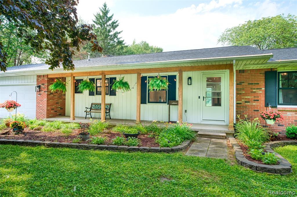 Calling all outdoor enthusiasts! This private, updated ranch sits tucked back off the road on just over 13 beautiful acres — the perfect blend of open space and wooded serenity. Located approximately 18 miles from downtown Lansing and only 5 miles from I-69, this property offers both privacy and convenience. Enjoy summer gatherings on the newly built deck (2022) or relax year-round in the hot tub located in the inviting three-seasons room. An oversized shed provides plenty of space for all your yard tools and outdoor gear. Inside, you’ll find a bright and welcoming home filled with updates, including new flooring, trim, carpet, paint, and light fixtures throughout. The kitchen features stainless steel appliances, a new sink (2025), and modern fixtures and flooring. The stove with convection oven and sink are brand new in 2025, while the fridge and dishwasher are only 5 years old. Both bathrooms have been tastefully updated with modern vanities and fixtures. Enjoy peace of mind with major system updates including Furnace and AC/Heat Pump (2021) – with transferable warranty, New sump pump (2023), Roof replaced (2019), Generator plug for added security during power outages. Abundant natural light fills the kitchen, dining, and living areas through the brand-new, black-framed windows, offering stunning views in every direction. The unfinished basement provides excellent potential for future living or entertaining space. Located in the Bath school district, with school of choice available at Laingsburg Schools, this home is efficient, updated, and truly move-in ready. Septic pumped June 2025. Whether you’re looking for peaceful country living, room to explore, or the perfect setup for outdoor recreation — this property has it all.