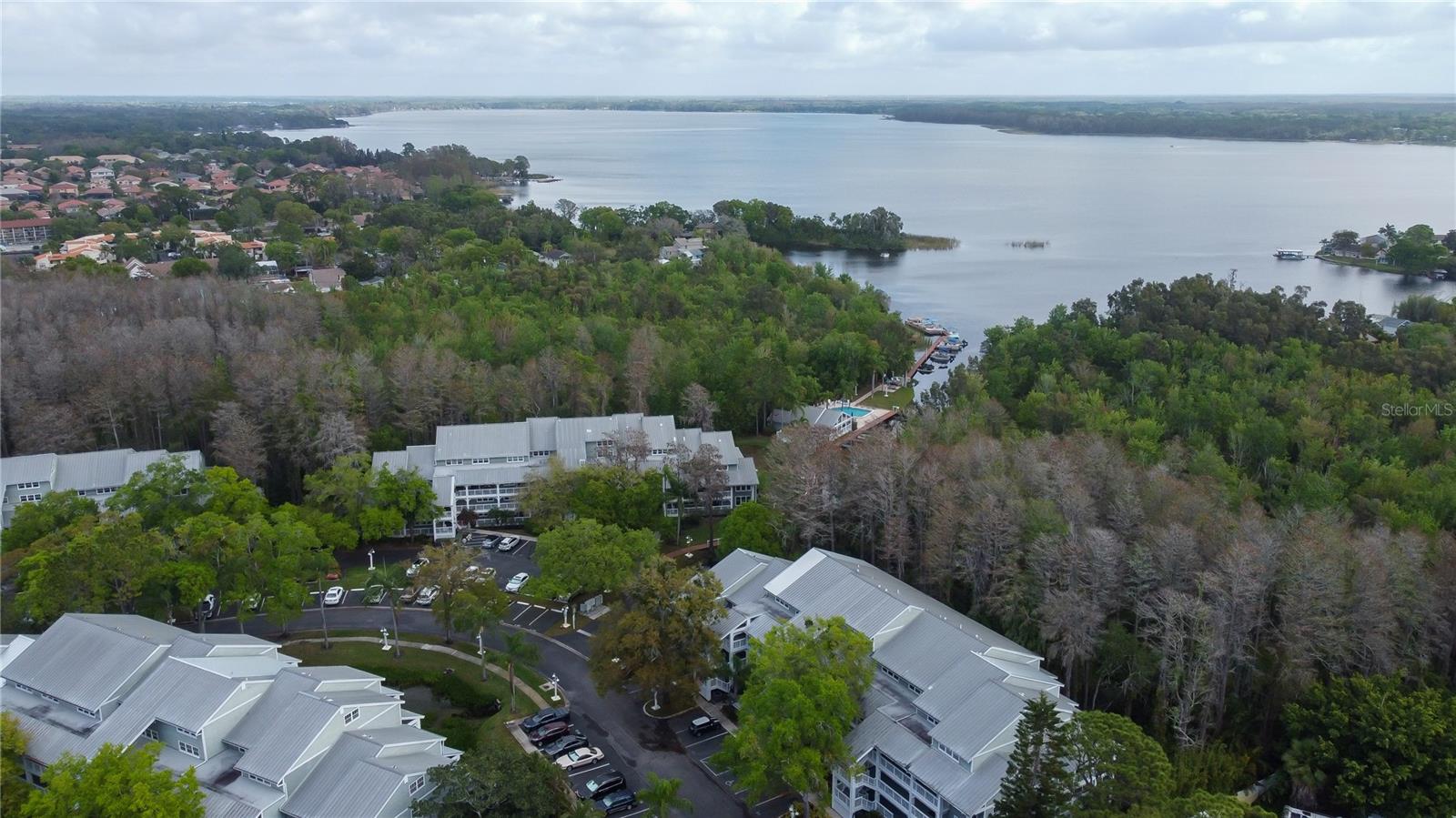 BIG NEWS! HOA FEE WILL BE REDUCED TO $602/MONTH BEGINNING JANUARY 2026! This condo is an INCREDIBLE FIND! 3rd floor unit with ELEVATOR IN THE BUILDING, TURN KEY, FURNITURE INCLUDED, 2 bedroom, 2.5 bathroom UPDATED gem in the fabulous community located on LAKE TARPON. Even the PONTOON BOAT IS INCLUDED WITH THE CONDO. The AC was just replaced 12/24, updated electrical panel 10/24. The HOA is in process of painting the exterior of the building. GORGEOUS GRANITE COUNTER TOPS AND NEWER KITCHEN CABINETS add to the delight of this SPACIOUS KITCHEN. There is lots of BAR STOOL SEATING AS WELL AS A BRIGHT SPACE IN THE KITCHEN FOR A TABLE OR COFFEE BAR. The OPEN FLOOR PLAN MAKES you feel like you are in a light and bright peaceful space. Enjoy relaxing on the ENCLOSED LANAI, there is plenty of space for everyone! There are CLOSETS GALORE AND all you need to bring is your clothes. The amazing floor plan features 2 PRIMARY SUITES. LAUNDRY CLOSET IS LOCATED UPSTAIRS for your convenience. One assigned parking spot and an abundance of guest parking is available for your convenience. 
Lake Tarpon is 4 square miles, the largest lake in Pinellas County. It is an amazing place where you can ENJOY SUNSETS AND WATERFRONT RESTAURANTS. Some of FLORIDA'S MOST BEAUTIFUL BEACHES ARE JUST A FEW MINUTES AWAY. Tampa International Airport is only about 30 minutes from Dolly Bay. 4 point inspection recently completed.