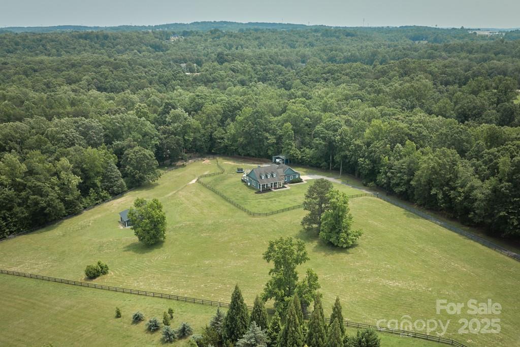 Back on Market - No fault of home or sellers.  Attainable equestrian property with trail access! Located in the Golden Hills community of Fairview Farm, a picturesque neighborhood of delightful horse farms, this 3BR/2BA Cape Cod style home offers comfortable living with an open floor plan that includes a great room with cathedral ceiling and stone fireplace. Primary ensuite bedroom with sizable bathroom and sitting room. Possibility to expand into attic area if more space is desired. For the equestrians, 20 private acres bordered by trees, with approximately 8 acres of lush pasture divided into 2 separate fenced areas. Run-in shelter. Rustic shed style barn. Space for additional barn and/or arena. Ride off property trail system thru 500+ acres of Golden Hills. Also eligible for FETA trail membership for an additional 100+ miles of trail riding, just a short trailer haul away. Peaceful country setting convenient to town and area amenities. Hard to come by location. Golden Hills is arguable the most stunning equestrian community in the region. Lots of potential with this one. Don't miss out!