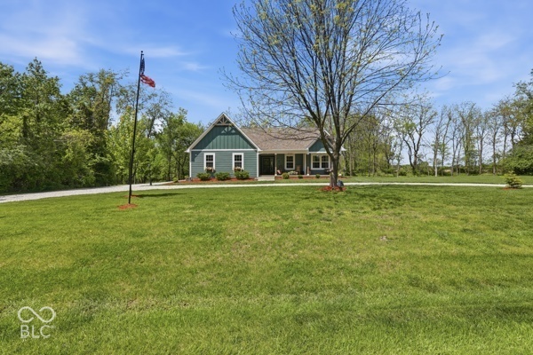 Beautiful, custom home on 3 lots that total 1.75 acres at Heritage Lake! With 4 bedrooms, 2 bathrooms and over 3300 sq ft of living space, there's room for everyone! Open concept living/kitchen/dining area. The brand-new kitchen features black cafe appliances, multi-tone cabinetry, butcher block & granite countertops, a center island and a separate pantry. The laundry room/mudroom is conveniently located off of the garage and offers TWO washer/dryer combos that stay. Separate office space off of the living area. The living room provides a cozy, electric fireplace and a large picture window that overlooks the beautiful back yard. The master bedroom features a trayed ceiling, walk-in closet and an en-suite bathroom. Master bathroom offers a double vanity, garden tub and a separate shower. The finished basement is spacious and has potential for extra bedrooms, bathrooms, etc. The mechanicals are located in the basement in a separate room. Sump pump has a new battery back-up. The two car attached garage has newer epoxy floors, plenty of cabinetry for extra storage and an air compressor hookup. The new composite back deck overlooks the spacious 1.75 acre lot. Inground trampoline that stays. Mostly surrounded by woods and fields, you'll forget you're even in a neighborhood. New roof/gutters in 2025. Don't miss out on this one, schedule your showing today!