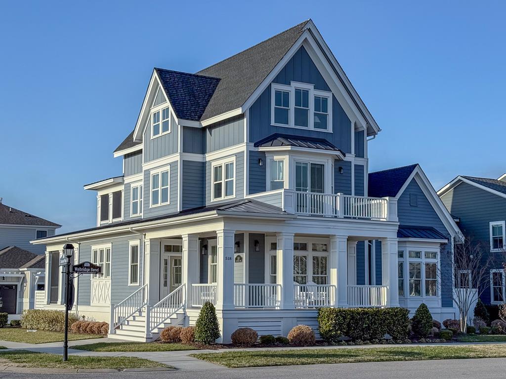 Experience coastal living in this magnificent three story 3,596 Sq ft. 5BR/4.5BA home with an office located in the highly desirable Bay Creek Community. This coastal charmer is in Bayside Village just a short walk to the beach and Life Center.  Enjoy the views of the golf course and the Chesapeake Bay from the comfort of your home. This home is designed with an open floor plan with spaciously sized rooms and porches allowing for relaxed living and entertaining. Highlighted features include a custom crafted kitchen designed with style and functionality, GE Cafe Appliances, a full house generator, dehumidified crawl space and an elevator shaft installed for future use. This property built by Simpson Builders exhibits the pinnacle of quality craftsmanship. The majority of furnishings convey.