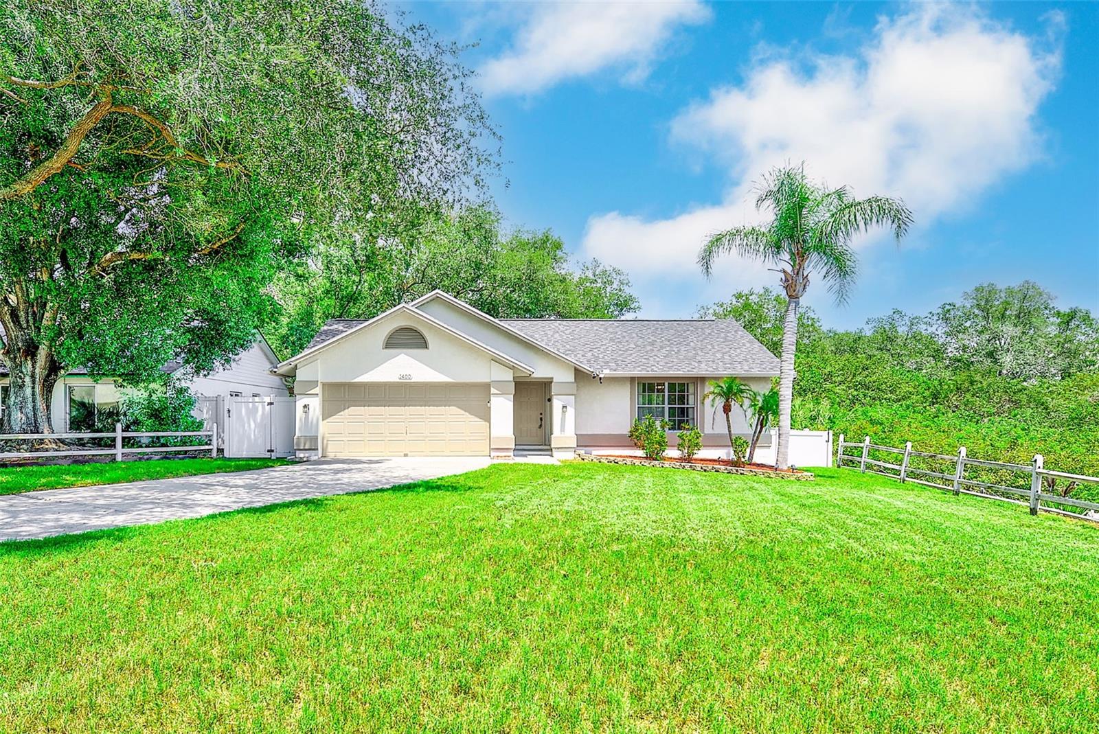 Come and live the ultimate Florida lifestyle. This single-story, 3-bedroom, 2-bathroom, 2-car garage home is located in the highly desirable Tarpon Springs community of Beckett Bay. Ideally situated at the end of the street on an oversized conservation lot with views of the Anclote River and its wildlife splendor. If you're an outdoor enthusiast, you're in luck; we have easy river access via a kayak or canoe via the community park next door. As you step through the front door, you'll immediately appreciate the thoughtful design and inviting ambiance. Just picture yourself hosting summer pool gatherings by your private pool with a river view. It's the perfect spot for sun-soaked afternoons. The three spacious bedrooms provide ample space for rest and relaxation, with large windows allowing in lots of natural light. Imagine unwinding on your pool deck with a glass of your favorite beverage. Beckett Bay isn't just about the home; it's about the lifestyle. Residents enjoy a fantastic recreational facility with a large community pool, tennis courts, basketball courts, picnic areas, grills, and a playground. You can also Hop on the nearby Pinellas Biking Trail—a 47-mile paved wonderland for walking, jogging, and cycling. When you're ready for a change of scenery, the coastal community of Tarpon Springs beckons. Explore its Mediterranean ambiance, enjoy shopping and dining, and perhaps even visit the famous Sponge Docks. Your new Beckett Bay home offers tranquility and convenient excitement—a rare combination that awaits you!Major improvements include a new roof (8/2025), A/C system (10/2023), gutters (9/19/2024), and upgraded Terminix insulation completed on 10/14/2024. Additional updates include a pool pump/motor replacement on 3/4/2025, kitchen faucet replacement (9/2025), and a new garbage disposal installed on 9/25/2026.Whether you’re relaxing poolside, entertaining guests on the screened lanai, or enjoying the privacy of the fenced yard, this home is designed for easy Florida living. Conveniently located near beaches, parks, shopping, dining, and everything Tarpon Springs has to share, this move-in ready home is one you won’t want to miss!