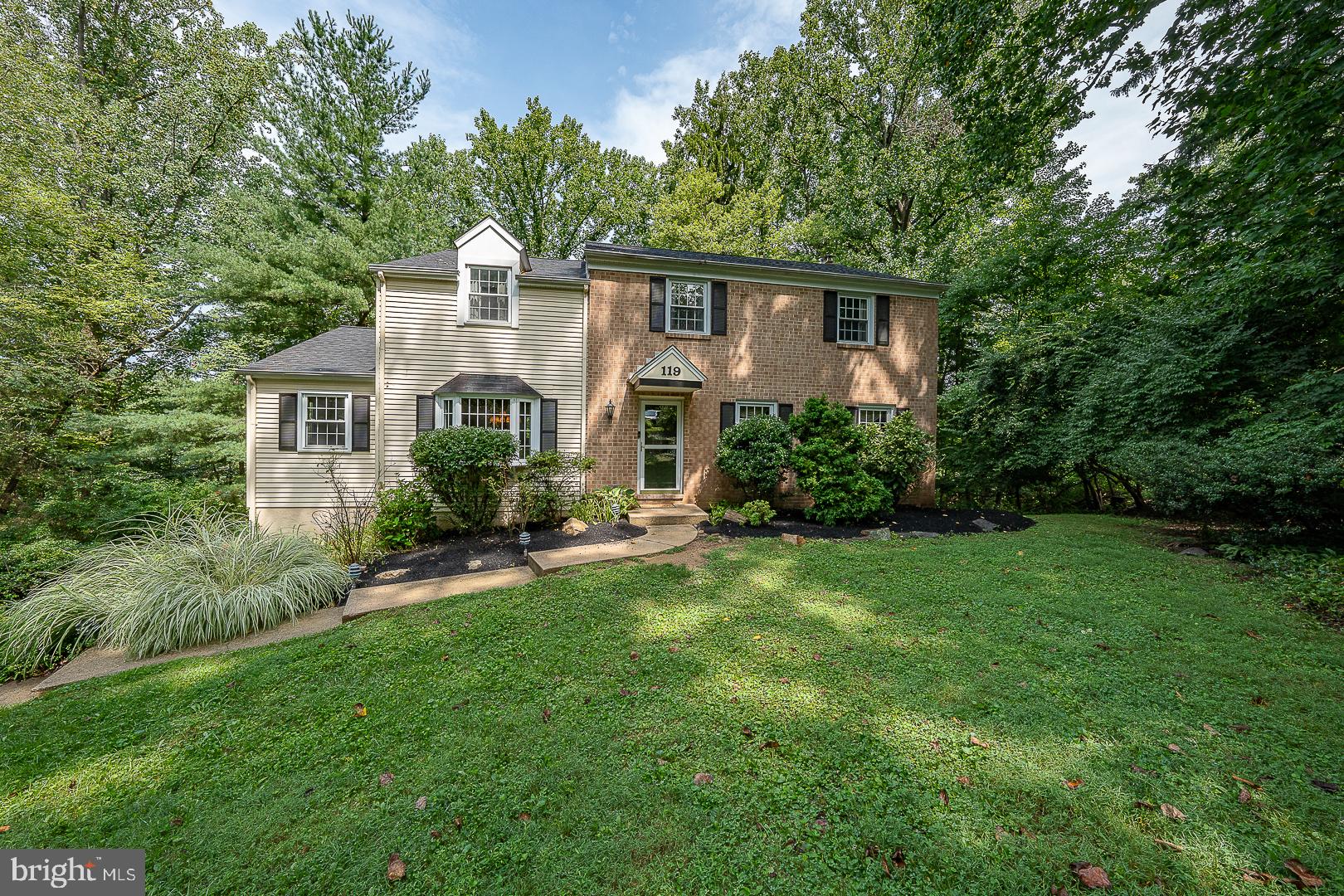 Enjoy peace of mind at 119 Maggies Ln., with numberous improvements and updates.  2026: New Roof with transferable warranty,  carpeting, retaining wall, deck stained and joist brackets replaced.  2025: New central air, hot water heater, whole house water softener, tile in kitchen and laundry. This well-maintained home enjoys 1.1 acres of privacy on a cul-de-sac in the award-winning Downingtown School District (Downingtown East & STEM Academy).  All with no HOA!  This property, located in Uwchlan Township, is one of the largest lots in the neighborhood.  Inside, you'll find more than 3,100 sq.ft. of finished living space with beautiful hardwood floors throughout most of home.  The living room features French doors and custom built-ins.  The warm and inviting family room centers around a brick-hearth fireplace with a wood/coal-burning stove, built-in shelving, recessed lighting, and crown molding.  The formal dining room features a bay window and chair rail and opens to the kitchen which offers Corian countertops, a tile backsplash, abundant cabinetry, updated appliances and flooring, and generous eating area.  Beyond the kitchen is a sizeable laundry room with pantry, cabinetry and tile flooring.  Upstairs features four bedrooms including a primary suite with hardwood floors, ceiling fan, two closets and a full private bath.  The three additional bedrooms also feature hardwood floors and ceiling fans.  The hall bathroom has tile floor, tub/shower combo and Corian top vanity.  The finished lower level adds a generous living and entertaining space with new carpet, wood-burning fireplace, powder room, ample light and open to the brick patio.  The elevated wood deck, a wonderful extension of the living space, offers a place to enjoy morning coffee, entertain, or unwind while watching the sunsets.  If you want a private escape that feels like you are in the Poconos--with proximty to great schools, trails, Marsh Creek and other parks, shopping, major roads, Septa Regional Rail, and much more--this is the property for you.