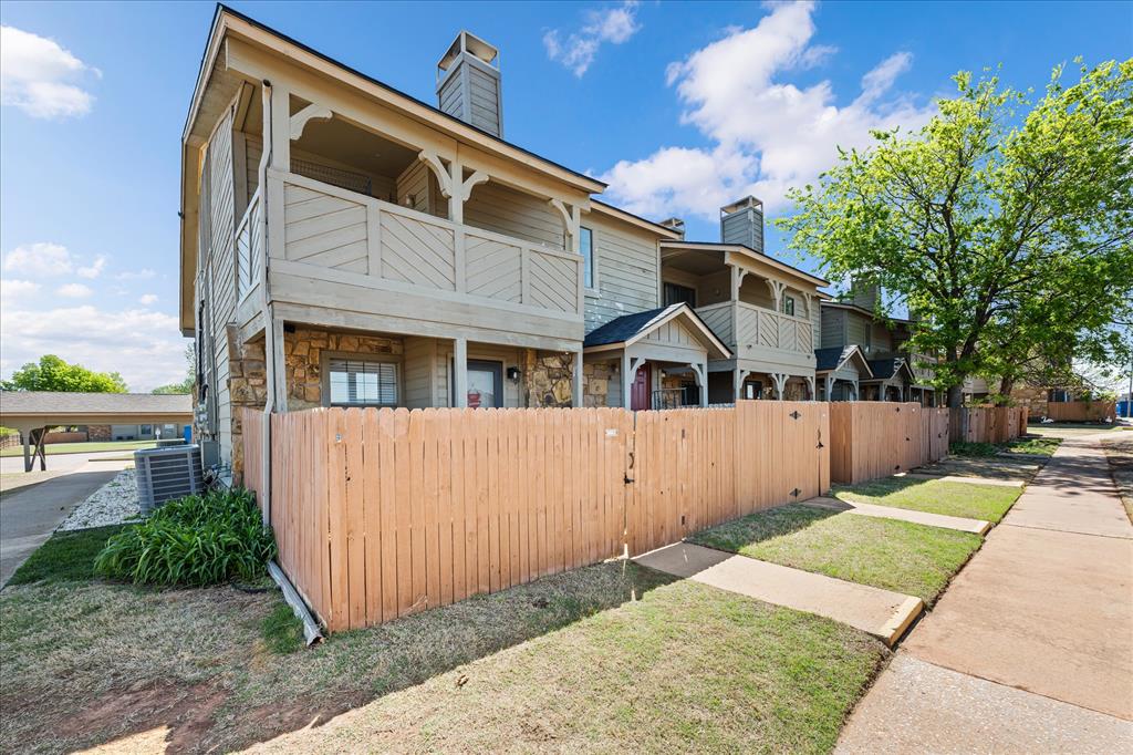 Welcome to this desirable Quail Springs Condo at 14441 N Penn Ave, Unit 57J, this is lower-level corner condominium located in a gated community, offering both comfort and convenience in an ideal location. Just minutes from the Kilpatrick Turnpike and surrounded by shopping, dining, entertainment, gyms, and everyday essentials, this home provides easy access to everything you need. The inviting living area features a cozy fireplace, creating the perfect space to relax or entertain. Natural light enhances the open feel, while the corner positioning offers added privacy. The kitchen is both stylish and functional, showcasing quartz countertops, ample cabinetry, and generous prep space, making it ideal for everyday living. The spacious bedroom includes a walk-in closet with a built-in dresser, providing excellent storage and organization. This unit also includes a covered carport space for added convenience. Enjoy true low-maintenance living with an HOA that covers water, sewer, trash, exterior maintenance, and common areas, along with access to community amenities including a clubhouse and pool. Located within highly regarded Edmond Schools, this condo offers a perfect blend of location, lifestyle, and ease of living. Welcome Home.