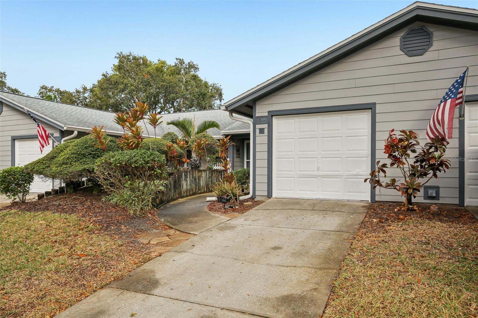 Come see this fabulously remodeled two bedroom two bathroom Villa in the popular Woods at Anderson Park neighborhood of Tarpon Springs. This villa lives more like a home, featuring front patio, attached garage and screened in Lanai in the rear. This home is high and dry and not in a flood or evacuation zone. After purchase, you can rent it out if need be, due to generous community policy! (3 Month Min) Come see the first rate renovations like the contemporary kitchen and remodeled bathrooms. New Ceiling fans throughout. The kitchen features an extra large granite Island, white shaker style cabinets and hardware, stainless steel appliances, and tons of storage including pull out shelves in the pantry. The bathrooms feature granite sinks and full upgrades. This neighborhood features a large clubhouse with library, game room, meeting/party room, large workout room, and an extra large, gorgeous, fully heated indoor swimming pool! You'll feel like you're on vacation at the Budapest hotel! Swim year round in any weather, rain or shine. Pool area features extra large outdoor deck and patio areas for sunning. There is second entrance/exit in the rear of the community for residents only, which gives you convenient access to groceries, the sponge docks Fred Howard State Park and it's gorgeous Beach, the lagoons and much more! HOA fee includes cable, water and sewer, among other things. This property is conveniently located to Honeymoon Island State Park, 30 minutes from Tampa international airport and downtown shopping, as well as lots of local shopping and entertainment. This gem is move-in ready and the most nicely remodeled unit in the entire complex! Come get it before it's gone!