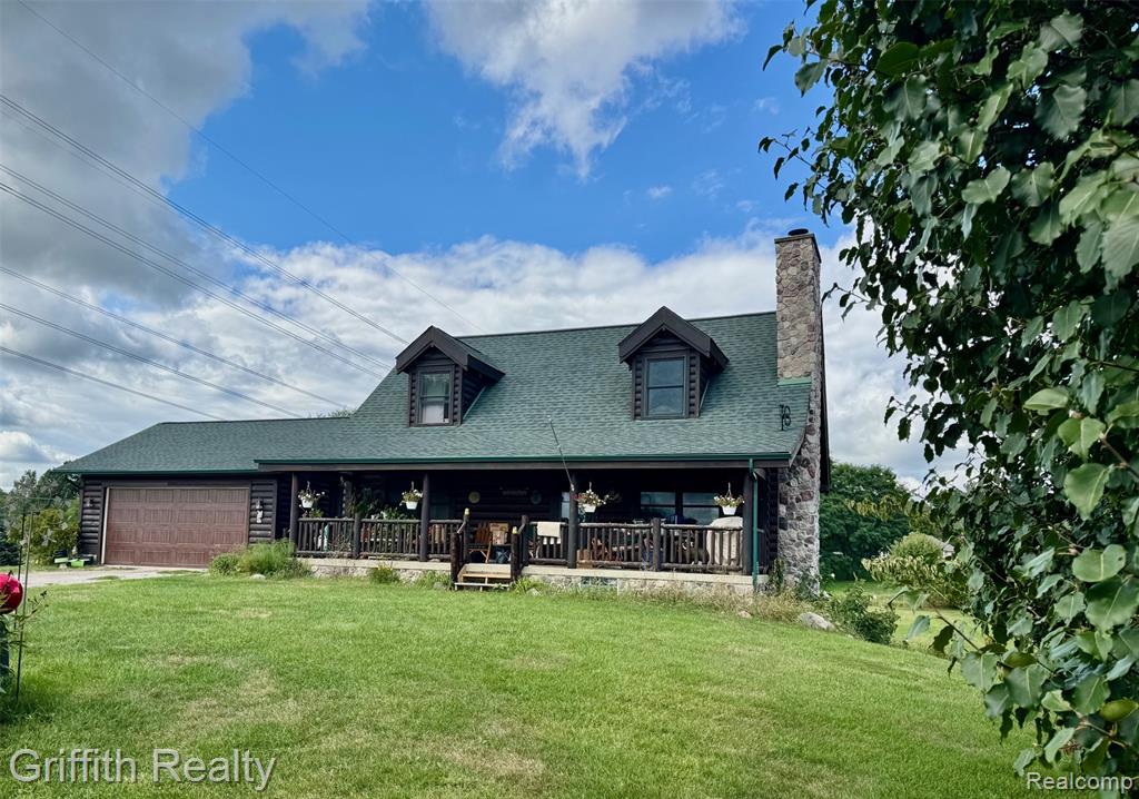 Have you dreamt of a Log Home in the country w/rocking chairs on a covered front porch? Welcome Home to a 3 or 4 Bedroom, 3Bath, 3,000 total finished sqft cape cod on 8.09 acres w/attached 2.5 car garage w/storage cabs, 30x24 barn, ponds, wildlife, a finished walkout apt in LL, w abundant peace & country quiet as well. The open floorplan is highlighted by vaulted ceilings, logs, beams, wood floors, open stair to the 2nd floor, a stone woodburning fireplace, w bath & bedroom on each level.  The Great Room boasts a stone fireplace to read or relax by as well, opens into the large dining area that will entertain everyone to your heart's content. The oak kitchen, located off the great rm, has room for your style country cooking, 2 pantries, 2 stacks of drawers, lazy-spin cabinet, granite counters, stone sink, all appliances stay, & snack bar. You will love the spacious primary bedroom on 2nd floor w/a huge step in closet, 2 extra closets, large primary ceramic bath w/granite counter. The 2nd flr loft could easily be a 4th bedroom for extra space.  A large 1st floor Bedroom w/double closet has a bath conveniently across the hall.  Convenient 1st floor laundry has good storage.  W/out LL features an apartment w/gathering rm w/stone area for pellet stove/or WB, dining area, Bedroom, Bath & kitchen, perfect for holidays and weekends.  An open space under the full length of the porch for storage, serves as a closet for bedroom & could be a private walk-in safe &/or weather shelter. The 36x8 back deck off the dining area overlooks the 8.09 acres, water, pine trees and fruit trees, wildlife, sandhill cranes (tall chickens) & such...rocker here too? Recent updates from 2023 include newer Lennox furnace, newer roof on house and pole barn, screens, smoke detectors, water softener, & newer AC.  Central Vac.  Pole barn w/skylights for light & two large doors. Tons of storage in the barn for those who need extra space for hobbies or those shorter chickens! A gas line is at the road.