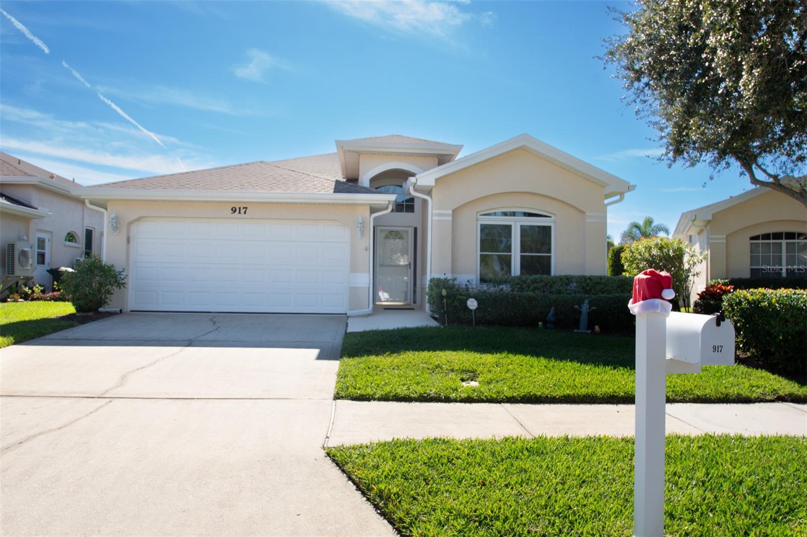 Welcome to 917 Michele Circle, a spacious and well-appointed single-family home nestled in the highly desirable Virginia Crossing community of Dunedin, Florida. This home offers 3 bedrooms, 2 bathrooms, a 2 car garage, and a luxurious and low maintenance lifestyle, allowing you to take advantage of the ideal location and community features. As you enter the home, you will be greeted by a spacious foyer leading to the open and inviting layout and a dining area which flows seamlessly into the ample sized living room. The floor-plan is functional and thoughtfully designed, highlighted by soaring high ceilings, crown molding, and architectural elements and windows which elevate the space and add warmth and an abundance of natural light. The spacious kitchen is equipped with granite counters, great storage, a breakfast nook and opens up to the living area via bar seating which extends around the entire perimeter. The generous sized primary suite provides privacy and a peaceful retreat, featuring a large bay window and a large en-suite bathroom with a soaking tub, dual sinks and plenty of closet space. Two additional large secondary bedrooms are situated in the front of the home and share a comfortably sized guest bathroom with a walk in shower. Additional features include an indoor laundry room with yet more storage space and an enclosed back lanai—ideal for additional living or entertaining space year-round. Stepping out of the lanai, is a private, fenced yard perfect for soaking up the sun and allowing space for Pets to roam.  Low HOA's cover roof, exterior painting, front lawn and shrub trimming, Irrigation and more.The community features a clubhouse and community pool nearby, and all of this is just a short golf cart or bike ride to the delightful downtown Dunedin waterfront and the endless array of dining, entertainment, breweries, shopping, and year round markets and festivals. Also close proximity to Honeymoon Island, Dunedin Blue Jays Stadium, the Pinellas Trail and local parks, Don't miss this opportunity to experience Dunedin living in this truly unique and beautiful community.