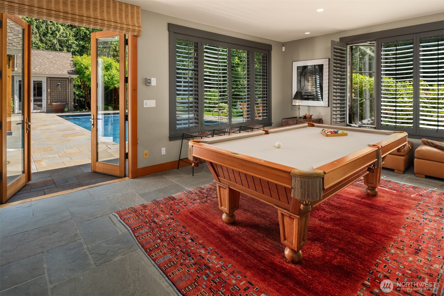 Game room with pool table and French doors to pool patio
