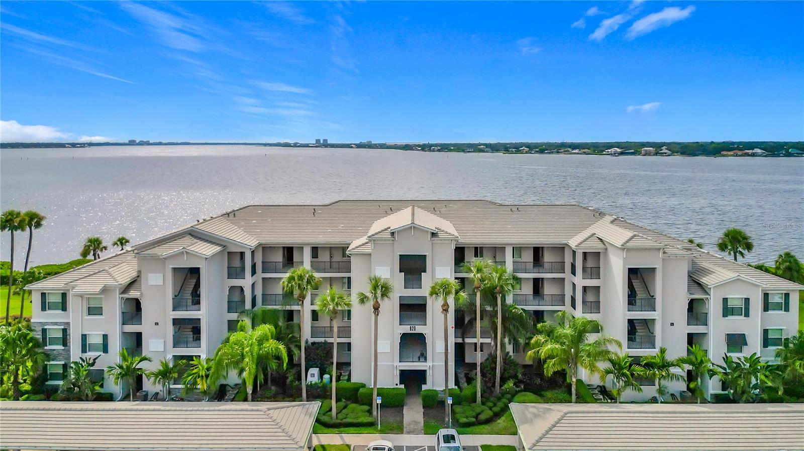 Experience stunning Manatee River views and resort-style living in this move-in-ready condo, perfectly situated in the highly desirable Tidewater Preserve community. This property is eligible for traditional financing. Built in 2019, this 2-bedroom, 2-bath home offers a bright and open layout, a spacious primary suite with dual walk-in closets, and a private screened lanai where you can unwind while watching boats, dolphins, and unforgettable Florida sunsets.

The chef’s kitchen is equipped with stone countertops, stainless steel appliances, and a generous island—ideal for entertaining. Tile flooring, tray ceilings, and an in-unit laundry area add to the comfort and convenience, along with an assigned covered parking space just steps from the building.

For boat lovers, this is truly a paradise. Tidewater Preserve features its own private marina with boat slips available to rent and direct lift access to the Manatee River and out to the Gulf. The gated community offers top-tier amenities including three pools (one overlooking the river), two fitness centers, tennis courts, a kayak/canoe launch, dog park, scenic walking trails, and two beautifully appointed clubhouses with kitchens, lounges, and more.

The HOA includes high-speed ULTRAFi internet and maintenance-free living, plus a full-time lifestyle director who coordinates neighborhood events and exercise classes. With easy access to I-75, Sarasota, UTC Mall, and both Tampa and SRQ airports, this location combines coastal charm with modern convenience—without the traffic of island living.

Schedule your private showing today—your waterfront lifestyle begins here!