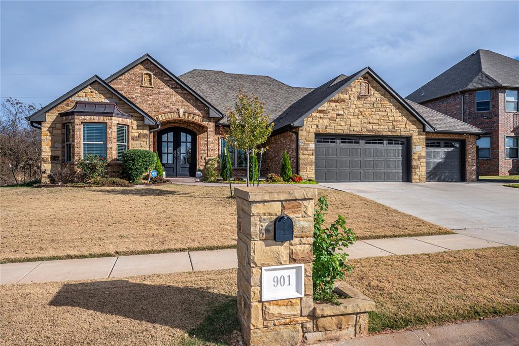 BUILDERS CUSTOM HOME,  with so many extra amenities! Country setting, but close to OU, HWY 9, and all that Norman has to offer. From the front patio courtyard you can enjoy fabulous sunset views over the neighborhood pond. Impressive double doors open to rich wood floors.  Designated private office has a vaulted, beamed ceiling, bay window, closet, & stately wood built in with a 2-sided desk. There is a powder bath for office convenience or guests.  The open concept great room has a stacked stone fireplace, built in cabinets, crown molding and large dining area.  The stunning kitchen will take your breath away!  Huge center island with vegetable sink, drawer microwave, paper towel drawer & trash cabinet , and massive storage on 3 sides.  Five burner gas stove has a pot filler, and custom spice drawers.  Soft close drawers, under counter lighting, & double ovens are a cook's delight.  The huge primary suite is on the right side of the house & boasts a tray ceiling, bay window & access to the back patio.  Luxurious bathroom has double sinks, jetted tub, spacious separate shower & walk in closet.  There is also a concrete safe room with  storage and a gun rack!  Secondary bedrooms are on the other side of the house with a lovely bathroom.  The vaulted covered patio has built in gas cooktop/grill (no tanks needed, as it's piped into gas line!), sink, & plenty of prep space.  The laundry/mudroom/butlers pantry has a sink, pantry, storage & is off the 3 car garage. There is a whole house surge protector & Generac generator, security & sprinkler system, tankless HWT,  foam insulation & solid wood doors.   Current owners have added $10,000 in landscaping & trees, including apple & peach trees, $30,000 solar panels, custom blinds inside & on front porch, updated outside lights & LED in garage.
