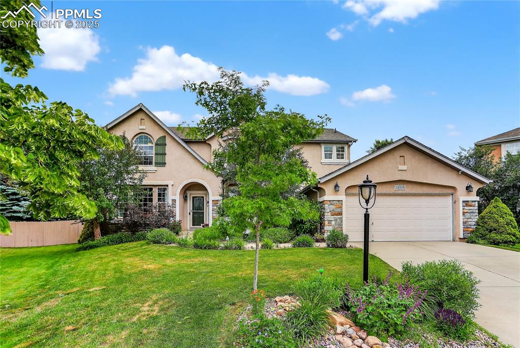 Located at the end of a quiet cul-de-sac in highly desired Pine Creek. Within walking distance to all levels of top-rated District 20 schools—safely walk or bike to elementary & middle schools without crossing a street. This home offers privacy, views, & a large treed backyard for kids and dogs to run. The front yard includes a charming stone seating area to enjoy the mountain scenery. Inside, the leaded glass front door opens to solid oak hardwood floors extending through the main living areas. The living room showcases large picture windows bringing in an abundance of natural light. Cooks will love the gourmet kitchen featuring a 6-ft island, chimney hood, Whirlpool gold cooktop, double oven and fridge, walk-in pantry, two sunny windows, & a slider to the extended patio. The family room features a 2-story ceiling, soaring arched windows & stacked stone gas fireplace. Relax in the spacious primary suite with its tray ceiling, picture windows with pine tree views, & en-suite 5-piece bath featuring a generous soaking tub, dual vanity, Pikes Peak views, and walk-in closet. 3 additional large bedrooms upstairs all have treed/mountain views. A dedicated office is perfect for those who work remotely or appreciate a separate workspace. The finished basement features a private 5th bedroom, bath with glass shower, spacious rec room with wet bar, pool table & mini fridge. Includes abundant built-in shelving for storage in both basement and 3-car garage, & a west facing garage for snow and ice melt. The fully fenced backyard retreat features mature trees-including Pines, Aspen, Maple, and Cherry-providing cooling summer shade and vibrant year-round color. A 16 x 12 patio extends entertainment space to the outdoors while a cedar swing offers stunning views of Pikes Peak. Minutes from Pine Creek Golf Course & parks, with quick access to major thoroughfares, dining, shopping, entertainment, hospitals, the Air Force Academy and Peterson AFB.