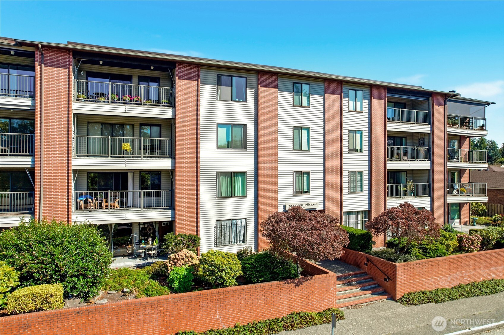 Your Parkside Paradise awaits in one of Magnolia’s most coveted locations. This renovated second-floor corner residence pairs timeless Old Seattle charm with effortless modern living. Abundant natural light pours through all-new windows, illuminating a thoughtfully refreshed interior that includes fresh paint, new flooring, and new carpet. Enjoy the convenience of a secure garage, two storage areas, and an in-unit washer and dryer. Just moments from Magnolia Village, parks, tennis, pickleball, swimming, local dining, groceries, and the beloved summer farmers market. Step outside to your covered balcony. It's a serene retreat for those looking to simplify without compromise, or an ideal home base for the downtown commuter seeking neighborhood tranquility with easy transit access to Seattle’s urban hubs.