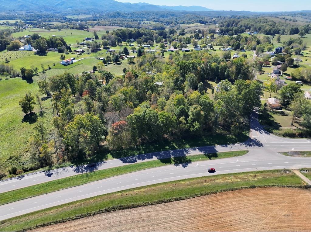 Corner of Highway 58 & Bethel Road Abingdon VA    A rare opportunity to own 4.116 acres at the prominent corner of Highway 58 and Bethel Road in Washington County, Virginia. Located in the well-known Bethel Woods area, this beautiful, mostly level wooded tract offers outstanding visibility, easy access, and tremendous future potential. With public electricity and water available, the property's level topography provides an excellent setting for a private estate, multiple homesites, or future investment. The size and layout offer the potential to be subdivided into multiple lots, subject to county approval. Its prime corner location along Highway 58 also presents an exciting opportunity for buyers to explore future commercial rezoning possibilities with Washington County. Conveniently located just minutes from the Town of Damascus, the Virginia Creeper Trail, the Appalachian Trail, historic downtown Abingdon, local wineries, shopping, restaurants, healthcare, and Interstate 81 at Exit 19, this property is ideally positioned for recreation, investment, and future growth. Whether you're seeking a premier residential development opportunity, investment property, or a strategic location for future growth, this tract combines location, accessibility, and versatility in one exceptional offering.