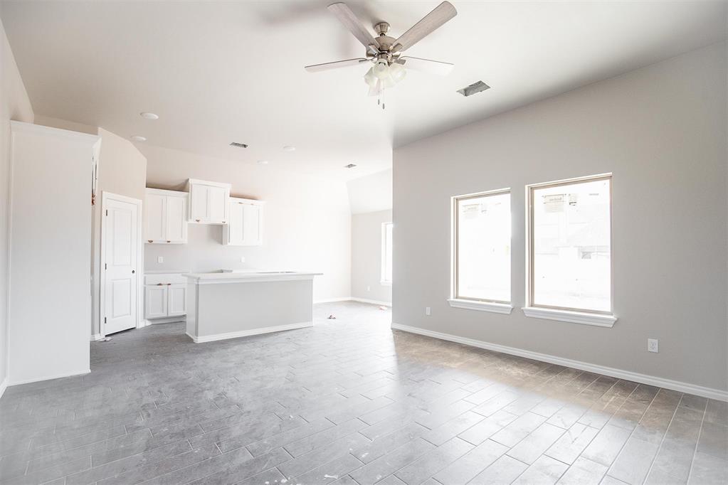 This Tero floor plan includes 1,680 Sq Ft of total living space, which includes 1,565 Sq Ft of indoor living space and 115 Sq Ft of outdoor living space. There's also a 385 Sq Ft, 2-car garage with a storm shelter installed. This affordable home offers 4 bedrooms, 2 full baths, covered patios, and a utility room. The great room welcomes large windows, wood-look tile, a ceiling fan, and Cat6 wiring. The charming kitchen has 3 CM countertops, stainless-steel appliances, wood-look tile, well-crafted cabinets with decorative hardware, a center island, and stylish tile backsplash. The primary suite is straight ahead and supports carpet flooring, a ceiling fan, and the perfect sized windows. The attached primary bath suits a dual sink vanity with an elegant countertop selection, an elongated water-saving toilet, a tub/shower combo, and a walk-in closet! The outdoor living section is covered and has fully sodded yards with smart home irrigation control. Other amenities include a tankless water heater, a fresh air intake system, and MORE!