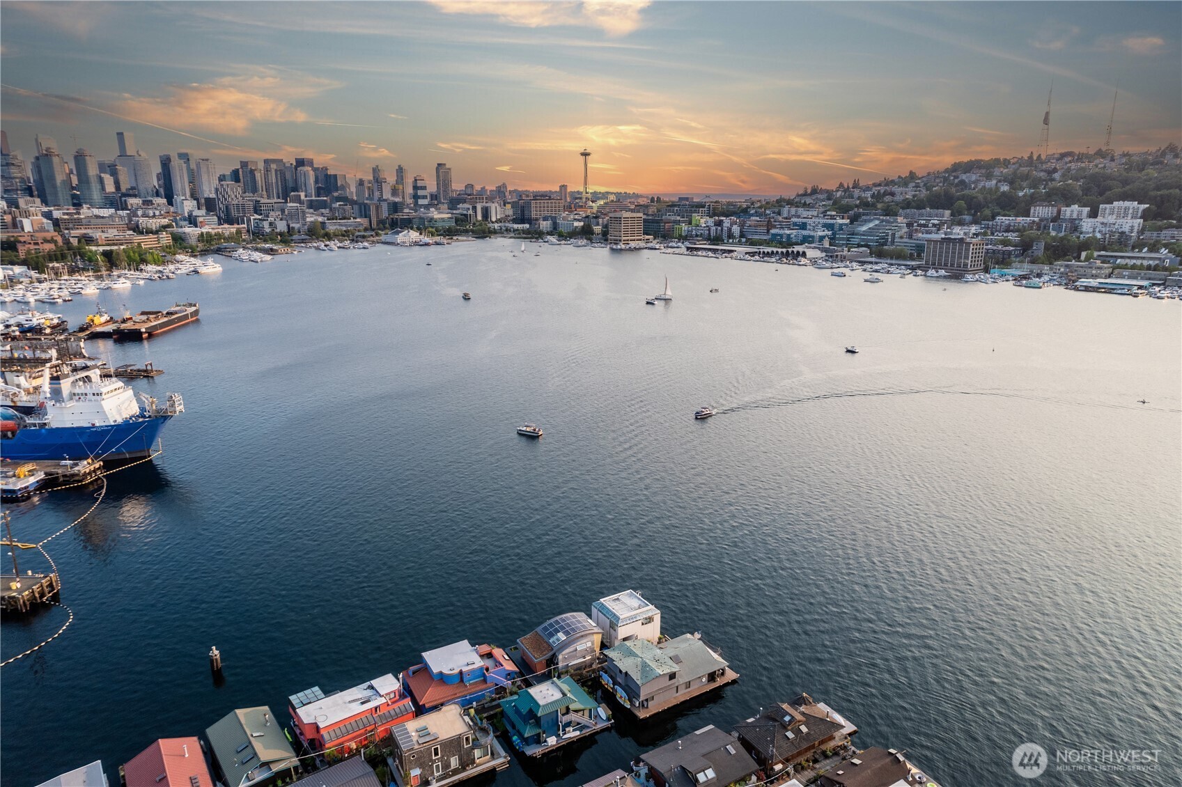 Originally designed by Jim Olson of Olson Kundig, this iconic end of dock floating home is the crown jewel of Lake Union. Located on the most southern dock in Eastlake, prepare to be blown away by the epic front & center 270 degree views as sights of the Seattle skyline pour in through gleaming wrap around windows. Wake up to stunning scenery in your primary suite w/ a hidden media center &  gorgeous marble & glass bathroom. Entire home has spectacular design & high functioning clean lines including a sleek modern kitchen and open floor plan with sliding doors that lead to the outdoors. Beautiful ironwood deck with waterside hot tub offers a connection with the water that is nothing short of visceral. This is the place.