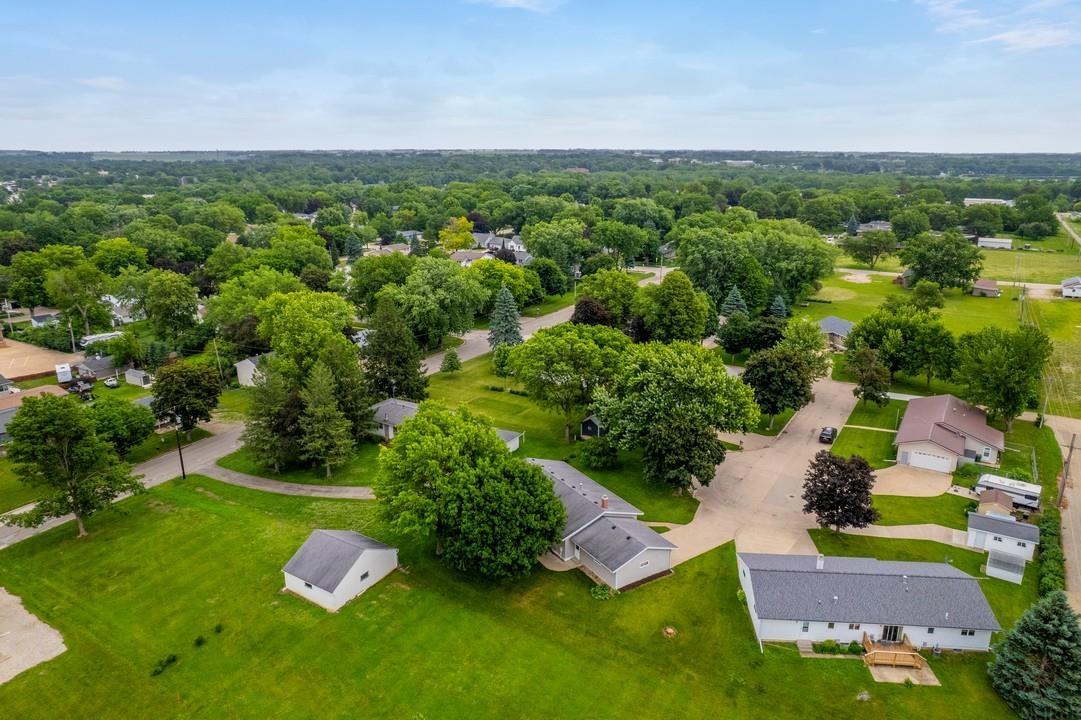 Prime location on a cul-de-sac on Riden Circle, a low-traffic south-side neighborhood in Charles City. Built in 1978, this well-maintained home offers convenient one-level living with 1,652 sq. ft. on the main level and an additional 1,332 sq. ft. in the basement. The excellent central-foyer design features an open floor plan and two main-level living areas. The family room, located off the kitchen and dining areas, includes a masonry gas-log fireplace. The separate living room features a sliding glass door that opens to the deck, patio, and backyard. The thoughtfully designed kitchen offers generous countertop workspace, naturally finished oak cabinetry, a peninsula, and attractive appliances. The spacious primary bedroom (22' x 11') includes a walk-in closet and is conveniently located adjacent to the hall bathroom. Two additional bedrooms are also generously sized and offer exceptional closet space. Located off the third bedroom are the laundry area and a versatile den/study/home office. The basement includes a full bathroom with a tub/shower, a game/recreation room, and five storage areas, including a concrete-encased storm shelter. Additional features include a 576 sq. ft. (24' x 24') attached, finished two-car garage with both front and rear entry doors. A new roof and gutters are scheduled for installation in the coming days. Simply stated, this is an outstanding property in a highly desirable location—one that deserves serious consideration.