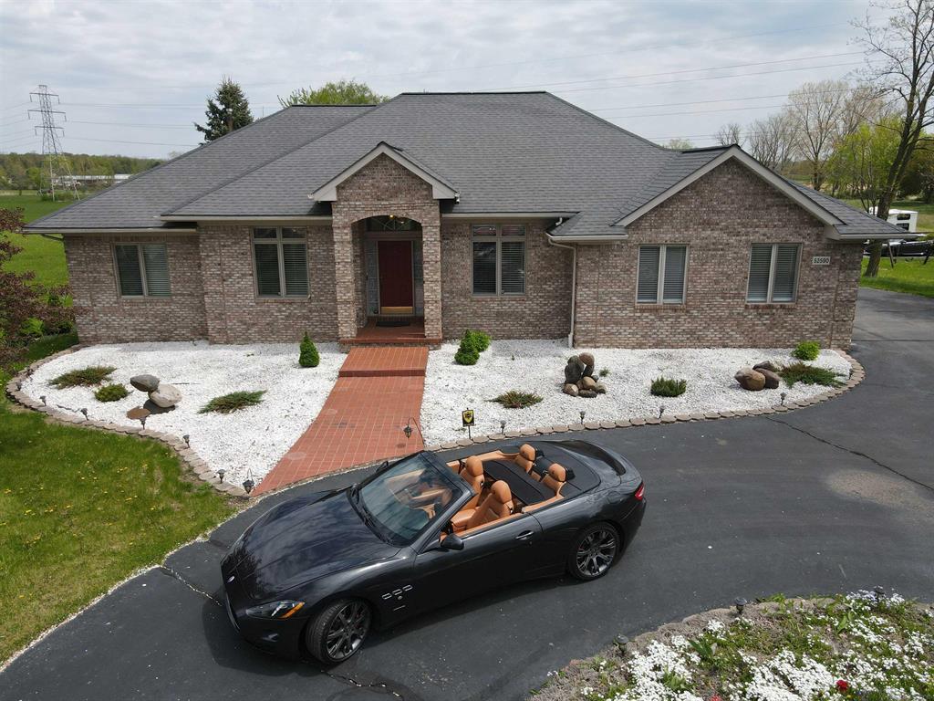 Discover the perfect blend of comfort, convenience, and charm with this stunning 5-acre mini-farm, hitting the market for the very first time! This exceptional property offers everything you've been searching for:  Virtual fly-through: https://www.youtube.com/watch?v=6DaPQus1l48  Spacious Barn: A 47ft x 24ft barn provides ample space for storage, equipment, hobbies, or a workshop. *Tractor with accessories & zero turn mower are negotiable.*  Fresh Eggs & Water: Enjoy a fully attached chicken coop for daily fresh eggs, plus two well taps for fresh water. Rainwater is also collected and stored in an underground container beneath the pergola.  Beautiful Home: Featuring 3 bedrooms, 3.5 bathrooms, and a thoughtfully designed floor plan. The vaulted ceiling in the living room adds a touch of elegance, while the separate prep kitchen off the main kitchen is perfect for entertaining or culinary enthusiasts.  Finished Basement: The expansive, fully finished basement includes an additional room ideal for a home office or flex space.  Prime Location: Conveniently located just north of 23 Mile Rd., with easy access to shopping, dining, and I-94. This property is a rare find, offering a serene lifestyle with modern amenities.  Don't miss the chance to make it yours-schedule your private showing today!   All showings must be accompanied by a licensed agent.