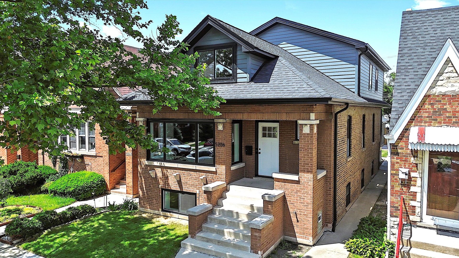 Experience refined luxury and impeccable craftsmanship in this fully renovated 6 bedroom, 4 bath classic brick bungalow, ideally located in Portage Park. Spanning approximately 3,600 square feet across three meticulously finished levels, this 2025 renovation perfectly blends timeless elegance with modern comfort. The sun-drenched main floor features a spacious living room with a custom electric fireplace and a show-stopping chef's kitchen complete with a large island, quartz countertops, white cabinetry, stainless steel appliances, and a stylish tile backsplash. The open layout flows effortlessly into the dining area and through sliding doors to a brand-new deck-ideal for seamless indoor-outdoor entertaining. A beautifully designed custom mudroom adds both charm and functionality. This level also includes a well-appointed bedroom and a designer full bath. Rich hardwood floors run throughout both the main and upper levels. Upstairs, you'll find three spacious bedrooms, including a serene primary suite with a walk-in closet and a luxurious ensuite bath featuring a dual vanity and walk-in shower. A second full bath with a large tub completes this level. The fully finished lower level offers exceptional versatility with a large family room, wet bar, two additional bedrooms, a luxe full bath, and laundry room. Outside, enjoy a generous fenced backyard, new concrete walkways, and a brand new oversized two car garage. No detail was overlooked, including a new roof, windows, doors, dual-zoned HVAC, spray foam insulation, 200 amp electrical service, new water line, tankless water heater, and complete plumbing and electrical systems. Located near the Blue Line, I-90/94, Six Corners, shopping, dining, parks, and pools-this is luxury living at its finest in a vibrant, connected community. Welcome home.