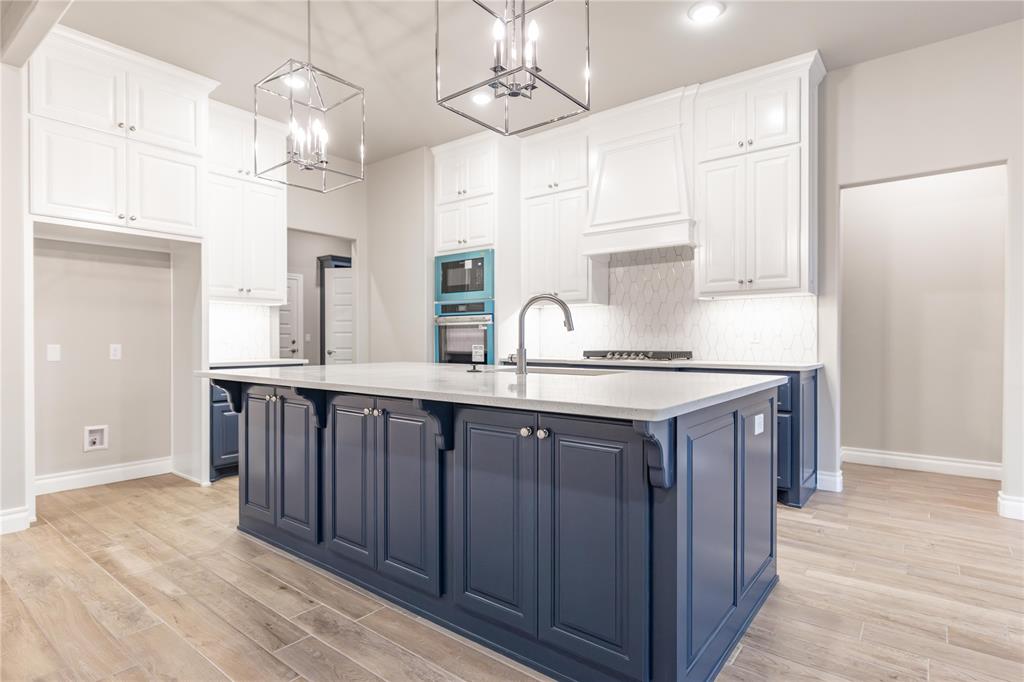 This Poppey Bonus Room 5 Bedroom floor plan includes 3,700 Sqft of total living space, which includes 3,350 Sqft of indoor living and 350 Sqft of outdoor living. This home offers 5 bedrooms, 3 full baths, a powder room, a bonus room, a study, a utility room featuring a utility sink, 2 dining areas, and a 3-car garage with an in-ground storm shelter installed. The great room presents a breathtaking coffered ceiling with crown molding and a ceiling fan, wood-look tile, large windows, rocker switches and eggshell paint throughout, and Cat6 wiring. The high-end kitchen supports 3 CM countertops, well-crafted cabinets to the ceiling with under cabinet lighting and cabinet hardware installed throughout, stainless steel appliances, a 5-burner cooktop, double ovens, a center island with a trash can pullout, gleaming tile backsplash, a separate corner pantry, and stunning pendant lighting. We also included a 3-panel sliding door with a 4’ back patio extension at the breakfast nook. The primary suite boasts a sloped ceiling with a fan, windows, Cat6 wiring, and our cozy carpet finish. The spa-like primary bath features separate vanities with framed mirrors, 3 CM countertops, a private water closet, a free-standing tub, a European walk-in shower with a rain showerhead, modern tile flooring, and a HUGE walk-in closet. Secondary bedrooms feature ceiling fans, windows, sizeable closets, and carpeted flooring. The covered outdoor living area includes a wood-burning fireplace, a TV hook up, and a gas line. Other amenities include our healthy home technology, a tankless water heater, a whole home air filtration system, R-44 insulation, and so much more.