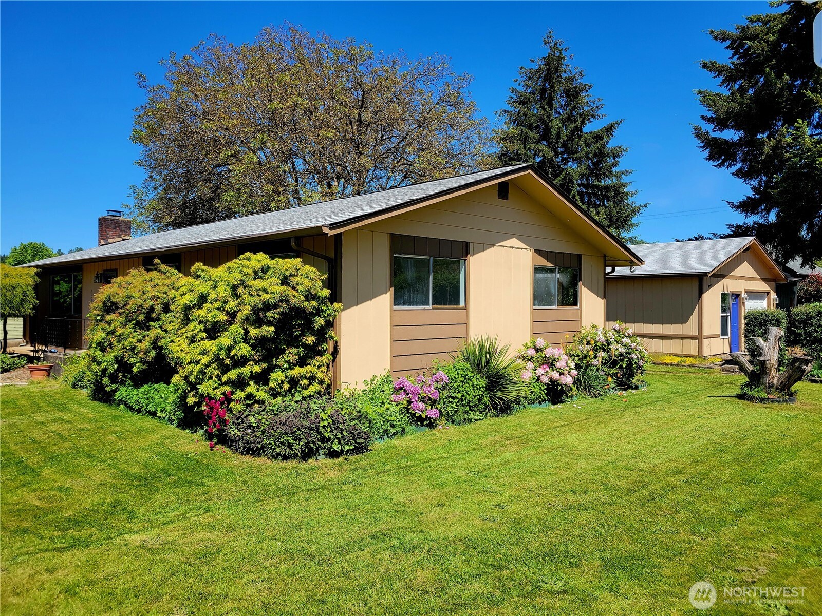 Move-In Ready Rambler with Home Office, Fiber Internet & Detached Garage!    Experience the perfect blend of comfort, convenience, and modern connectivity in this freshly updated 3-bedroom, 1,714 sq. ft. rambler situated on a desirable corner lot. Clean, vacant, and ready for immediate occupancy, this home is ideal for today's work-from-home lifestyle.    Step inside to discover fresh interior paint, spacious living and dining areas, New Stainless Appliances and a versatile bonus room perfectly suited as a dedicated home office, creative studio, homeschool space, or hobby room. With fiber internet available, you'll enjoy the speed and reliability needed for remote work, streaming, gaming, and staying connected.    The functional one-level floor plan features a cozy wood-burning fireplace, generous room sizes, and an easy flow designed for comfortable everyday living. New appliances are included, making your move even easier.    Outside, relax on the deck while enjoying the added privacy and curb appeal of the corner lot. The finished detached two-car garage provides abundant space for vehicles, storage, a workshop, or recreational equipment—offering flexibility that today's buyers appreciate.    Combining small-town charm, modern updates, high-speed internet access, and valuable workspace options, this move-in-ready home is a rare opportunity you won't want to miss.
