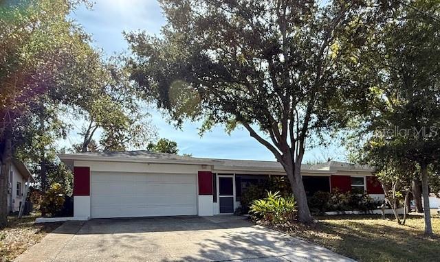 Welcome to this charming, golf-cart-friendly Dunedin home! Situated on a desirable corner lot, this residence offers 3 bedrooms, 2 bathrooms, and a 2-car garage. The roof was fully replaced in February 2025 for added peace of mind.You'll love the convenient location-just minutes from downtown Dunedin, the Pinellas Trail, and plenty of shopping and dining options. The Dunedin Causeway and Honeymoon Island are also close by, making it easy to enjoy Florida's beautiful outdoors.Don't miss your chance to own a home in this wonderful community!