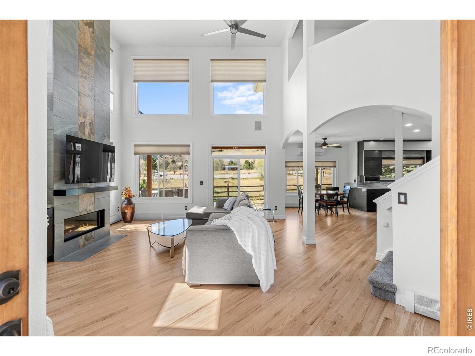 Wake up to views of the Foothills out your bedroom windows... watch the weather come in from your patio, enjoy being ON the trails and foothills in this updated and move-in ready home that has been completely transformed. New interior paint throughout and new flooring make it shine! You'll be WOW'd upon entry with the soaring living room with gas fireplace and custom tile with an abundance of light and views from windows all around you. Chefs will LOVE the gorgeous high-end kitchen with Blum Cabinetry, 48" Gas Range and Built-in Refrigerator. The primary suite upstairs includes a private balcony to take in the foothill views right out your bedroom door. With new carpet throughout the upstairs, there are 2 other sizeable bedrooms that share a full bathroom. The basement is sprawling with a home theater/ rec room, a gorgeous bathroom, a 5th bedroom and huge workout room/dual purpose room; perhaps another bedroom, a home office or craft room! Main floor has a bedroom with adjacent 3/4 bathroom or a perfect home office space. Buyer will also benefit from the owned Solar Panels! The LOCATION of this home is unbeatable - ON the foothills with Foothills Trail out your back door. Bike, run, walk, enjoy the nearby dog parks and enjoy gliders that use the open space daily. It's a prized location in the heart of North Boulder.