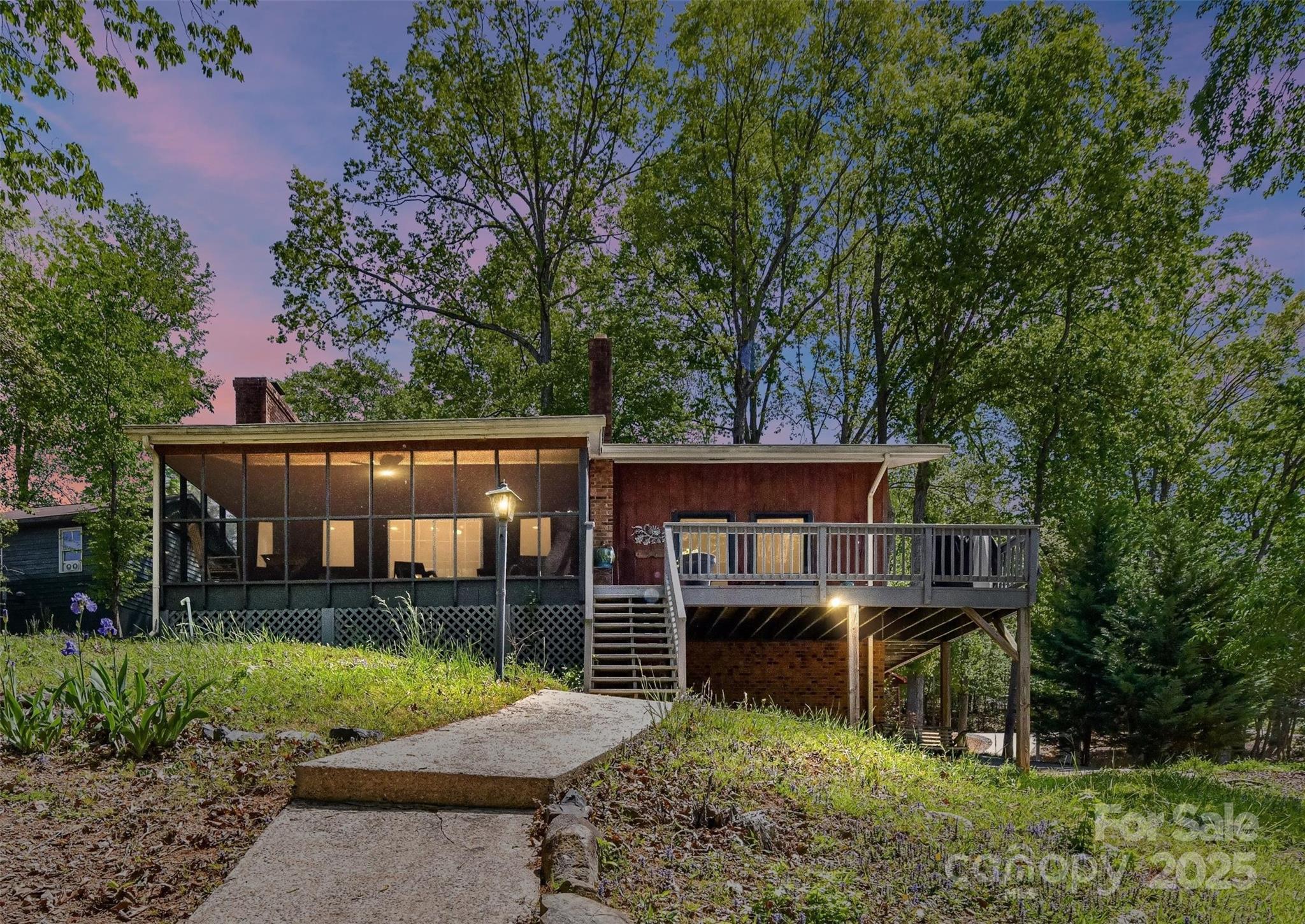 Lakefront living at its finest in the gated Carolina Forest community! This beautifully updated home sits on nearly ¾ of an acre with direct waterfront access, a private dock, and a boathouse with two slips. Enjoy peaceful mornings on the screened-in porch and cozy evenings by the firepit. Inside, you'll love the newly renovated kitchen with new appliances and countertops, plus new flooring and fresh paint throughout. Community amenities include a pool, tennis courts, clubhouse, and scenic nature trails. Nestled across from Morrow Mountain State Park and just minutes from Uwharrie National Forest, endless opportunities for hiking, boating, and exploring nature are all around you. Your perfect Lake Tillery retreat awaits!