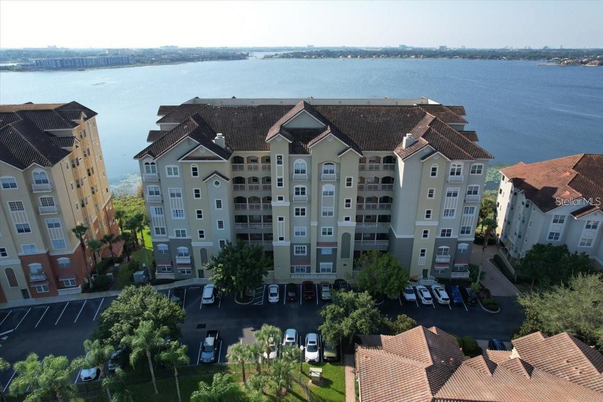 WATERFRONT LUXURY LIVING IN THE HEART OF DR. PHILLIPS – VIZCAYA COMMUNITY!   “Location! Location! Location!” This stunning 2,162 sq.ft. 2-bedroom, 2-bath residence in the exclusive Vizcaya community offers breathtaking lakefront views of Big Sand Lake from the kitchen, dining room, living room, and master suite. Enjoy Florida sunrises, sunsets, and evening fireworks from all 3 major theme parks right from your private balcony.
Completely upgraded with over $120,000 in designer finishes, this home blends contemporary luxury with timeless design. The primary suite features 600-year-old wood floors imported from China, a custom walk-in closet, and a spa-style bath with a freestanding Contura air tub, Hansgrohe fixtures, dual vessel sinks, body-jet shower system, and a dramatic wall fountain. The gourmet kitchen includes bamboo flooring (made in Germany), granite countertops, Thermador 75-bottle dual-zone wine cooler, Fisher & Paykel double-drawer dishwasher, and stunning stacked stone and glass mosaic backsplash.
Additional features include espresso-stained maple floors in the guest suite, tray ceilings, crown molding, plantation shutters, wood blinds, a 4-person sauna- WOW! HOT SAUNA!, balcony with retractable screen, GE Profile laundry appliances, utility sink, water softener, and assigned garage parking with extra storage.
Vizcaya residents enjoy resort-style amenities: tennis courts, swimming pool, fitness center, playground, and 24-hour gated security. Located in the heart of Dr. Phillips, steps from “Restaurant Row,” shopping, and entertainment.
This rare offering is perfect for primary buyers, investors, or second-home owners seeking luxury waterfront living in one of Orlando’s most desirable communities. Schedule your private showing today!