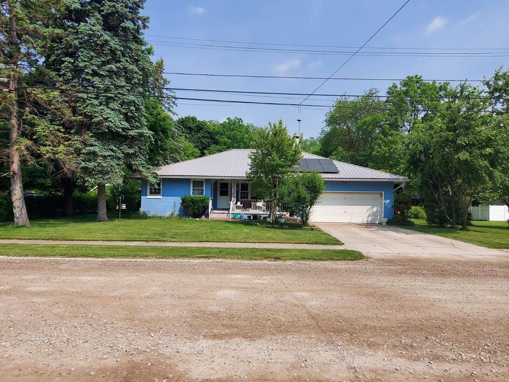 This 3 bedroom estate features uncommonly large rooms with hardwood floors through out, cove ceilings and unique design on over a half acre. Lots of windows for natural light, a natural brick fireplace with built in blower, full ceramic bathroom, Kitchen has 22 foot counter with as many cabinets and ceramic floor, staircase to walkable attic area (potential 2nd story if finished) Giant basement that was professionally waterproofed, Enclosed back patio/sunroom with new flooring. 30k solar powered system with battery back-up new in 2019, cinder block construction and metal roof. 2 Car Attached garage, with 2nd garage w loft. Backs up to Venoy Park across the river and new canoe dock launch