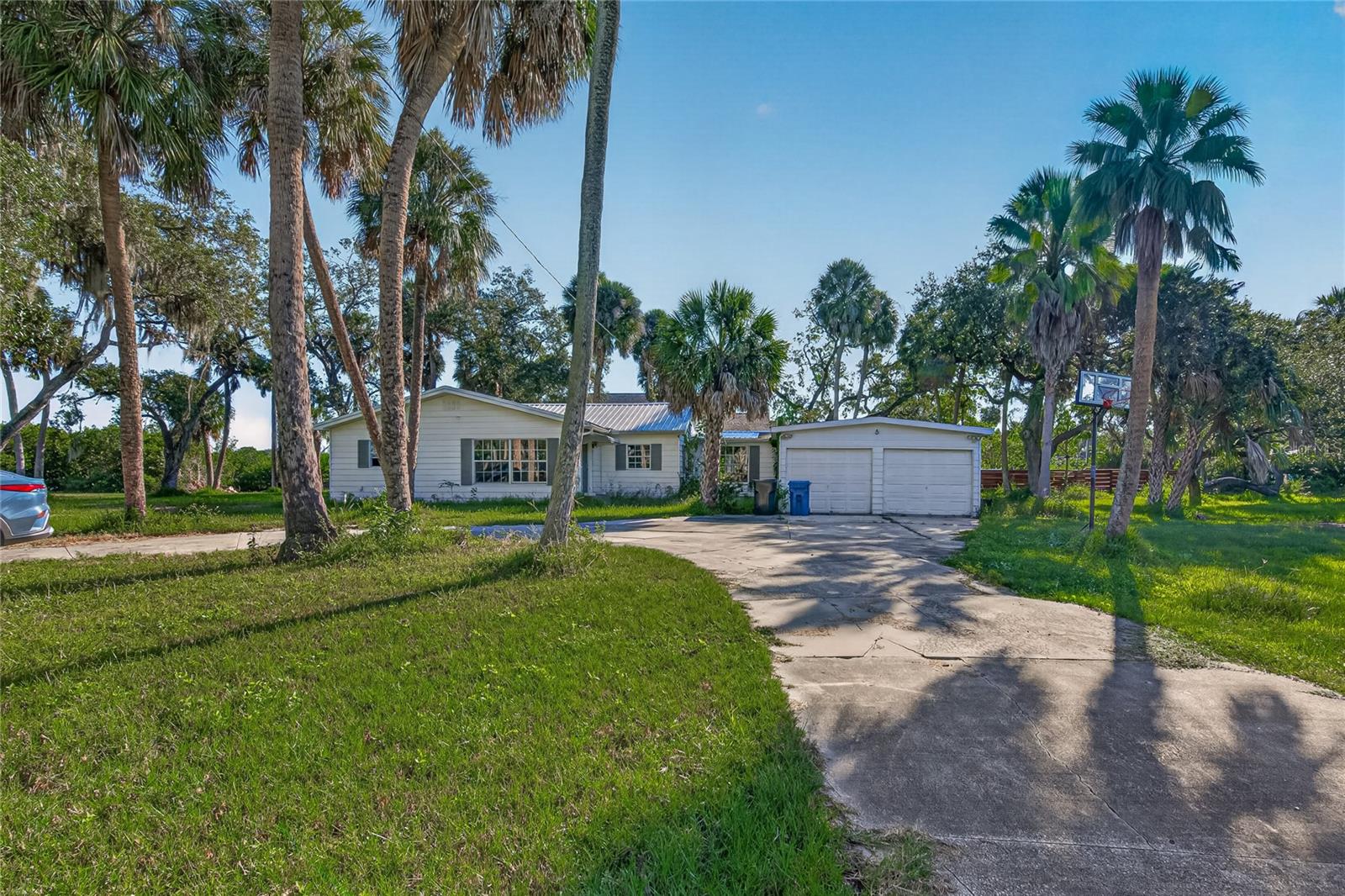 Riverfront opportunity with no HOA and no CDD! This 3-bedroom, 2-bath single-family home has been fully gutted to the studs and is ready for a complete rebuild or renovation to your own design. It sits at the end of a quiet cul-de-sac with water views of the Palm River leading to McKay Bay. The sale includes the home plus the rear parcel that provides river frontage, for a combined 0.4581 acres. The home sits on a crawl space foundation with a metal roof. Features include an in-ground pool, a circular drive, and a 2-car attached garage. Ideal for investors, builders, or buyers ready to create their waterfront home. The adjacent lot is also available for purchase separately and is not included in this listing. Sold as-is. Cash buyers preferred.