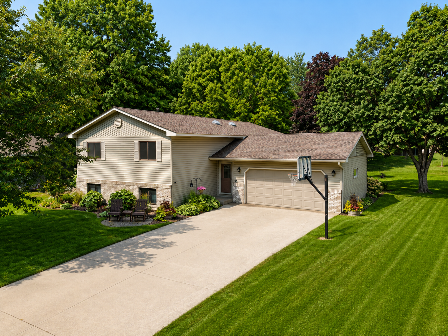 Tucked away on a quiet, private cul-de-sac, this beautifully cared for one owner home is surrounded by mature trees and set on a spacious, park like yard. With 4 bedrooms, 2 baths, and a thoughtfully designed two-level addition, the home offers an impressive amount of space for gathering, entertaining, and everyday living. At the heart of the main level is a gorgeous, quality remodeled kitchen featuring custom cabinetry and granite countertops, opening to a large living room, designated dining area, and cozy hearth room centered around a beautiful stone fireplace. The generous primary bedroom is also located on the main level and offers additional space for a sitting or lounging area. The lower level features three spacious bedrooms, a bathroom, family room, game room with pool table, and an oversized laundry area. Step outside to the backyard deck overlooking the expansive, level yard and established landscaping, an ideal setting for relaxing or gathering with family and friends. Lovingly cared for and thoughtfully improved over the years, this home has evolved into a comfortable, welcoming space that truly feels like home.
