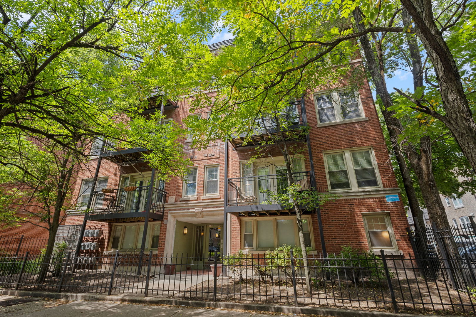 Bright and stylish 2-bedroom, 2-bath condo in sought-after Ravenswood! This sunny unit offers an inviting open layout with hardwood floors, stainless steel appliances, rich cherry cabinetry, and granite countertops. The primary suite features timeless charm with the ensuite bath with subway tile surround and brand-new vanity, toilet, updated lighting, added shelving, and sleek new shower shelves-perfect for both function and comfort. The 2nd bedroom is well-sized and offers good closet space. Relax on the private outdoor terrace, perfect for entertaining! Additional highlights include in-unit laundry with a newer washer and dryer, individual HVAC, and great natural light throughout. Located just steps from the train and all the shops and restaurants Ravenswood has to offer. Parking is included in the price!