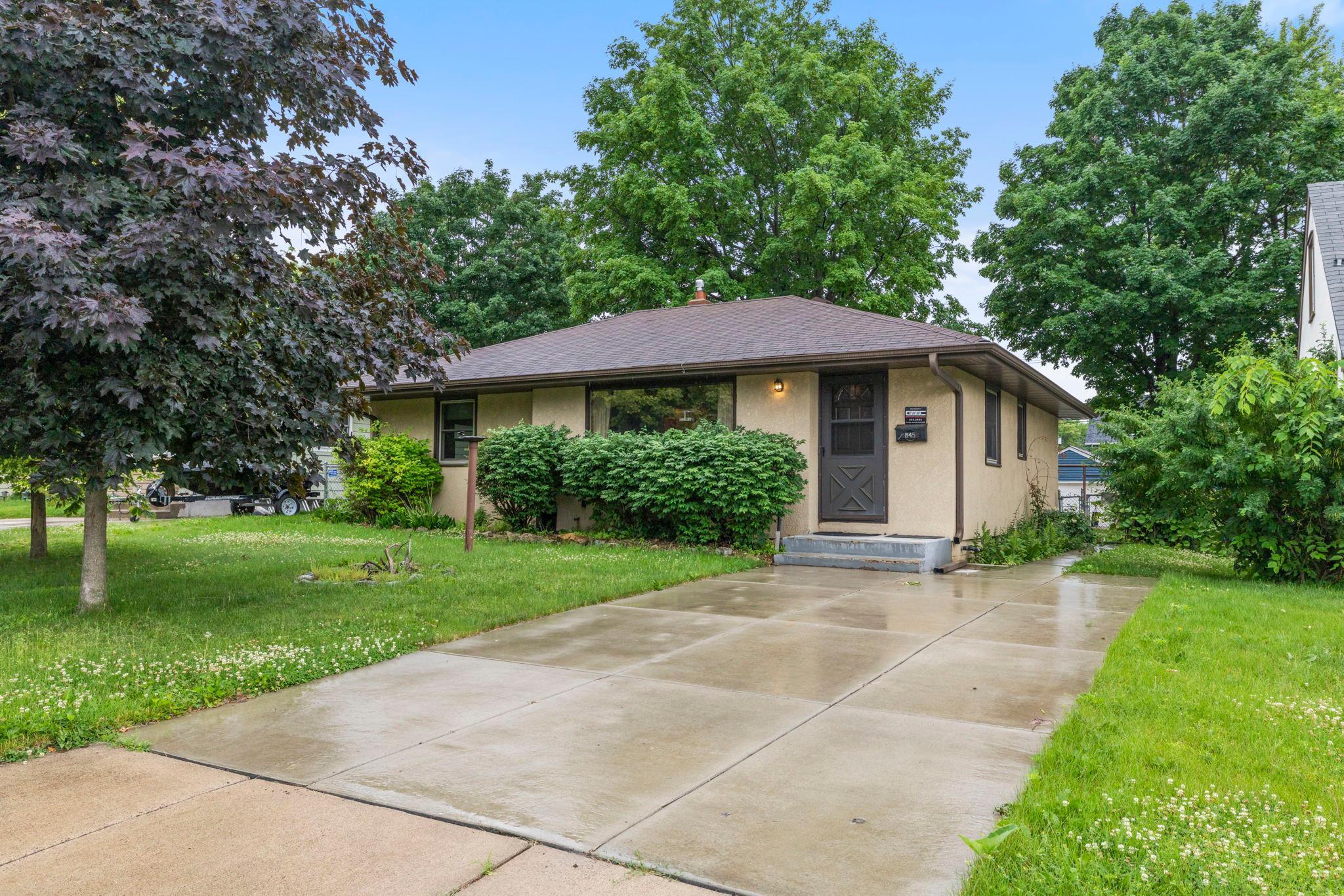 Welcome to this charming 3 bedroom, 1 bathroom home nestled in the heart of South Saint Paul, a community celebrated for its tight-knit character and coveted riverfront location. Enjoy walkable access to the Mississippi River, endless outdoor trails, and the beloved Thomson County Park right at your doorstep.Step inside to a spacious living room anchored by a large picture window framing peaceful views of the front yard. The kitchen flows seamlessly off the main living area, appointed with a gas stove, tile backsplash, new flooring, and a window overlooking the side yard. Adjacent, the dining room is bathed in natural light, creating an airy space for everyday meals and gatherings alike.Accessible from both the kitchen and dining room, the unfinished lower level offers generous space and endless potential, whether you envision additional living area, a home gym, office, workshop, or extra storage.Step outside to a fully fenced backyard with a spacious concrete patio, perfect for entertaining and relaxing. A detached 2-car garage sits at the rear of the property with alley access, offering convenience and additional storage.Three generously sized bedrooms each feature hardwood floors, abundant natural light, and spacious closets. The main level bathroom is a true standout, with stunning tile half-walls that carry seamlessly into the shower-tub surround.This South Saint Paul gem offers an unbeatable location, thoughtful details, and endless potential. Do not miss your opportunity to make it yours.