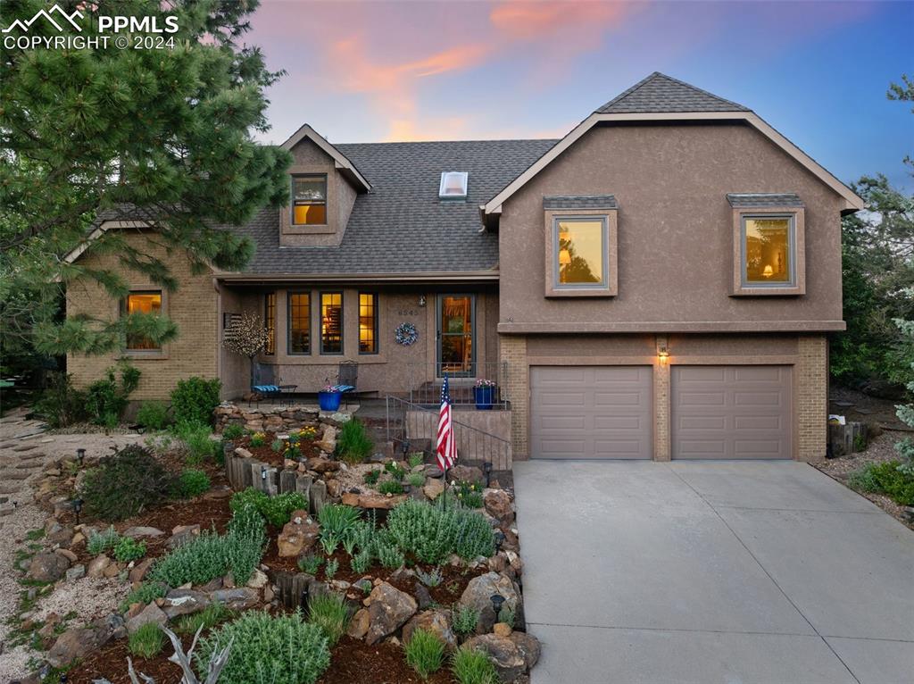 This gorgeous home in the heart of Rockrimmon has been lovingly & meticulously maintained & boasts impeccable updates, spectacular landscaping, serene privacy on a large lot, and so much more - welcome home! Enter to find gleaming redwood floors throughout the warm and inviting main level w/ plantation shutters. Spacious living & dining rooms coupled w/ the large greatroom w/ vaulted beamed ceiling and gas fireplace with beautiful stonework and hearth offer a seamless blend of formal and casual living areas - ideal for entertaining or cozy nights in. The kitchen with quartz countertops, newer stainless steel appliances & sunny dining nook is a chef's delight. And walk out to over 500 sq ft of flagstone patio space spanning 3 levels. Don't miss the additional level yard space above the patio - perfect for a play area or future sport court. The 1/3 acre lot provides plenty of room for outdoor activities, gardening, or hosting barbeques, and the adjacent 6 acres of dedicated open space offers walking trails - don't miss the bench at the top of the hill - the perfect vantage point to take in 4th of July Fireworks or the AFA flyovers on graduation day! Head upstairs to the master bedroom with private en-suite 3/4 bath, & 2 additional nearby bedrooms share the full bath. The laundry space is conveniently located on this level as well. The spacious loft is a perfect home office or play room, and bed 4 completes the top floor. Fully finished basement with wood-burning stove has bed 5, full bath & add'l bonus room complete with sauna. Additional features of this fantastic home include large lockable storage room in oversized garage, workbench & cabinets in garage, central air conditioning, Andersen and Pella windows, DIY putting green in backyard, patio wired with 220V outlet for hot tub, mature trees for ultimate privacy, newer appliances, culdesac location & so much more! Don't miss your opportunity to own this stunning home in a prime location close to every amenity!