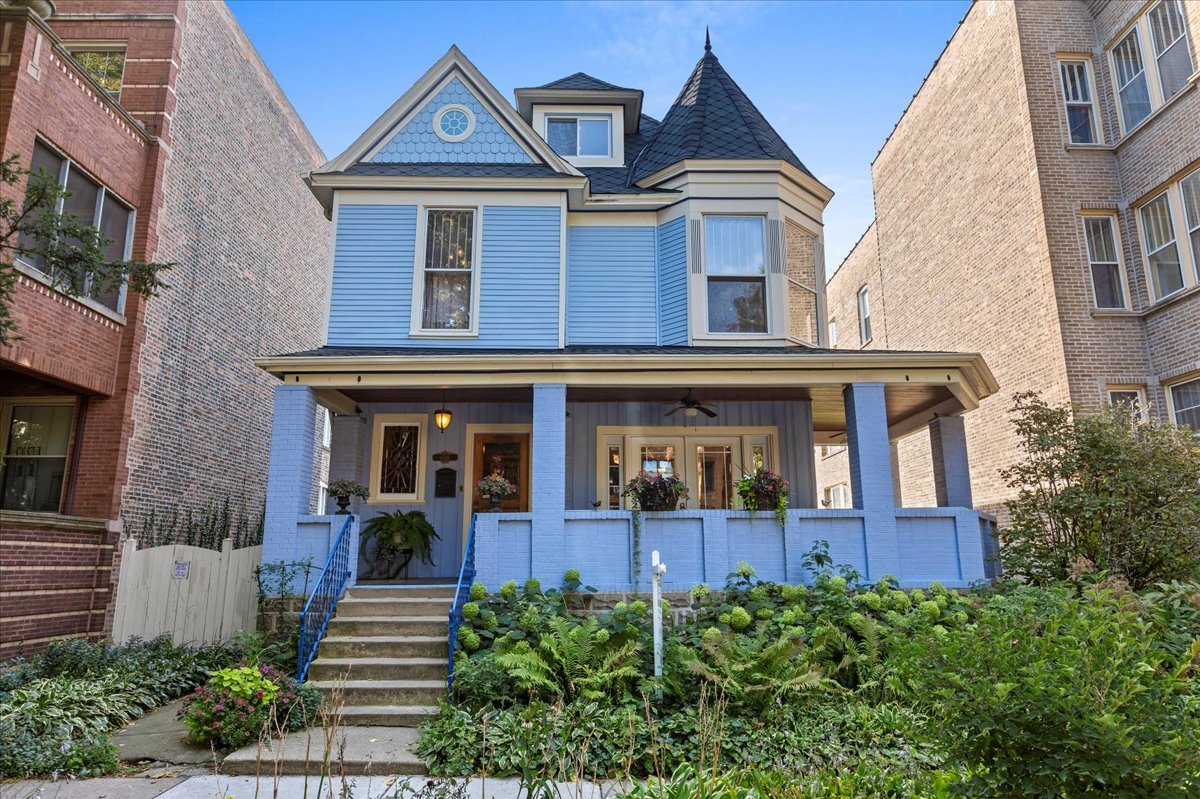 Welcome to this one-of-a-kind 1895 Queen Anne stunner, tucked away on a peaceful, tree-lined street in the heart of Edgewater Glen. With its stately presence, wrap-around porch, and storybook gardens, this home feels like something out of a magazine-but with all the modern comforts you crave.    Sitting proudly on a rare double lot, this gem offers over 2,900 sq ft of living space/above grade and 1,160 feet in the basement, for a total of 4,060 square feet, and a backyard paradise with perennial flowers, a veggie patch, and plenty of space for summer parties, backyard games, or simply lounging with your favorite book.    The exterior has been lovingly cared for with premium Hardy Board siding and a custom roof (2014). Two oversized 2.5-car garages? Yes, you read that right-perfect for cars, hobbies, or creating your dream workshop.    Inside, every detail has been reimagined with style and craftsmanship. Newly installed teak hardwood floors and custom millwork flow seamlessly throughout. The gourmet kitchen-decked out with sleek stainless steel appliances (2019)-makes entertaining effortless, especially when paired with the open main-level layout and built-in sound system.    The basement is a total knockout: fully gutted and redesigned with acid-stained concrete floors, a chic bathroom, a dedicated laundry room, and upgraded copper plumbing + brand-new electrical to keep everything running smoothly.    Upstairs, the primary suite is a spa-worthy retreat, boasting a marble-clad bathroom with a no-threshold frameless steam shower, an air-bubbling soaking tub, and a double vanity that might just inspire you to spend a little extra time getting ready. The third-floor en-suite is an incredible bonus-perfect for guests, in-laws, or that dreamy work-from-home office.    And let's not forget the unbeatable location: stroll to the lakefront, Andersonville's vibrant dining scene, Whole Foods, the Red Line, and top-rated schools.    Vintage charm. Modern luxury. An address everyone will envy. Welcome home to Edgewater Glen living at its finest.