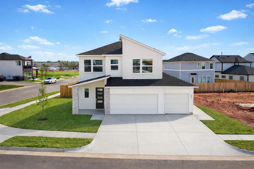 LIMITED INCENTIVE - Ask for details. The Tremont Modern with Balcony Design at 4100 NW 179th Street in Anthem, Deer Creek Community, captures the essence of modern sophistication while embracing timeless comfort. From the moment you arrive, you’re welcomed into a bright, open main living space where a sleek electric linear fireplace serves as a striking focal point and sets the stage for relaxed luxury. The flowing layout seamlessly connects the living, dining, and kitchen areas, creating an ideal environment for both everyday living and entertaining. At the heart of the home, the gourmet kitchen shines with a freestanding gas range, gleaming quartz countertops, under-cabinet lighting, kitchen refrigerator, and designer finishes that strike the perfect balance of beauty and functionality. Kitchen connects to the dining room. The private primary suite offers a serene escape with a balcony, and highlighted by a spa-inspired bathroom with a glass-enclosed shower, dual-sink vanity, freestanding tub, and an expansive walk-in closet designed for effortless organization. Secondary bedrooms are equally inviting, each thoughtfully designed with walk-in closets and large windows that flood the rooms with natural light, creating warm, welcoming spaces for family or guests. Every detail has been considered to ensure a true move-in ready experience. A fenced yard with gate, zoned irrigation system, tankless water heater, & post-tension engineered foundation provide peace of mind, while stylish white faux wood blinds throughout add a polished finishing touch.  Anthem’s resort-style amenities include a pool, outdoor recreation areas, basketball court, playground,& pickleball court. Located minutes from top-rated Deer Creek Schools, with easy access to Oklahoma City’s dining, shopping, & entertainment, Anthem offers the perfect balance of community living. Corner homesite.The photos are of a similar floor plan design with different finishes. Completion end of April.  Welcome Home!