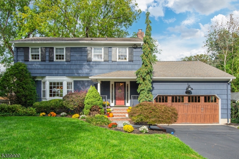 Your search will be over when you see this stunning four-bedroom Colonial! Ideally located on a picturesque street in the highly desirable Wilson School District, just moments from town, schools, and Mindowaskin Park, this home truly has it all. Step inside to an elegant, spacious floor plan designed for today's lifestyle and effortless entertaining. The sun-filled living room with French doors flows seamlessly into the formal dining room and gourmet kitchen. The tastefully renovated chef's kitchen boasts custom cabinetry, granite countertops, high-end stainless steel appliances, farmhouse sink, & pantry, & opens to the inviting family room with custom built-ins, cozy fireplace, & views of the patio and backyard.First-floor highlights include a spacious mudroom with cabinetry, convenient laundry with sink, a stylish powder room, and a welcoming foyer. Upstairs, the private primary suite features a beautifully renovated bath with glass-enclosed shower. Three additional bedrooms and a full hallway bath complete the second level.The expanded lower level is ideal for work & play, offering a finished recreation room, office & bar area with wine fridge, an exercise room, and abundant storage. Outdoor living is a dream with a paver patio overlooking the private, spacious yard perfect for gatherings and relaxation. Thoughtful updates & renovations leave nothing to do but unpack & enjoy! Conveniently located near top-rated schools, parks, NYC transportation, and Downtown Westfield.