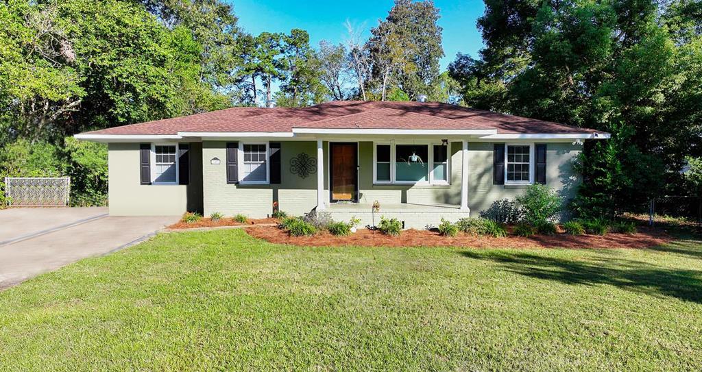 Drive your golfcart downtown! This beautifully remodeled 4-bedroom, 2-bath home perfectly blends modern comfort with small-town charm.  Enjoy the ideal location just minutes from Downtown Thomasville, Publix, Lowe's, Gateway shopping, and Remington Park, where you'll find youth sports, a pool, playground, basketball court, and skate park. Take a stroll to nearby Cherokee Lake to watch the ducks or enjoy an evening walk under the oaks.  Inside, the home features new roof and windows (2023), fresh paint, new carpet, updated bathrooms, a kitchen with all new appliances, and under-cabinet lighting. Outside, relax in the private fenced backyard, complete with three covered parking spaces and three storage sheds (one with power).  This home is completely move-in ready—just unpack and start living your best Thomasville life!