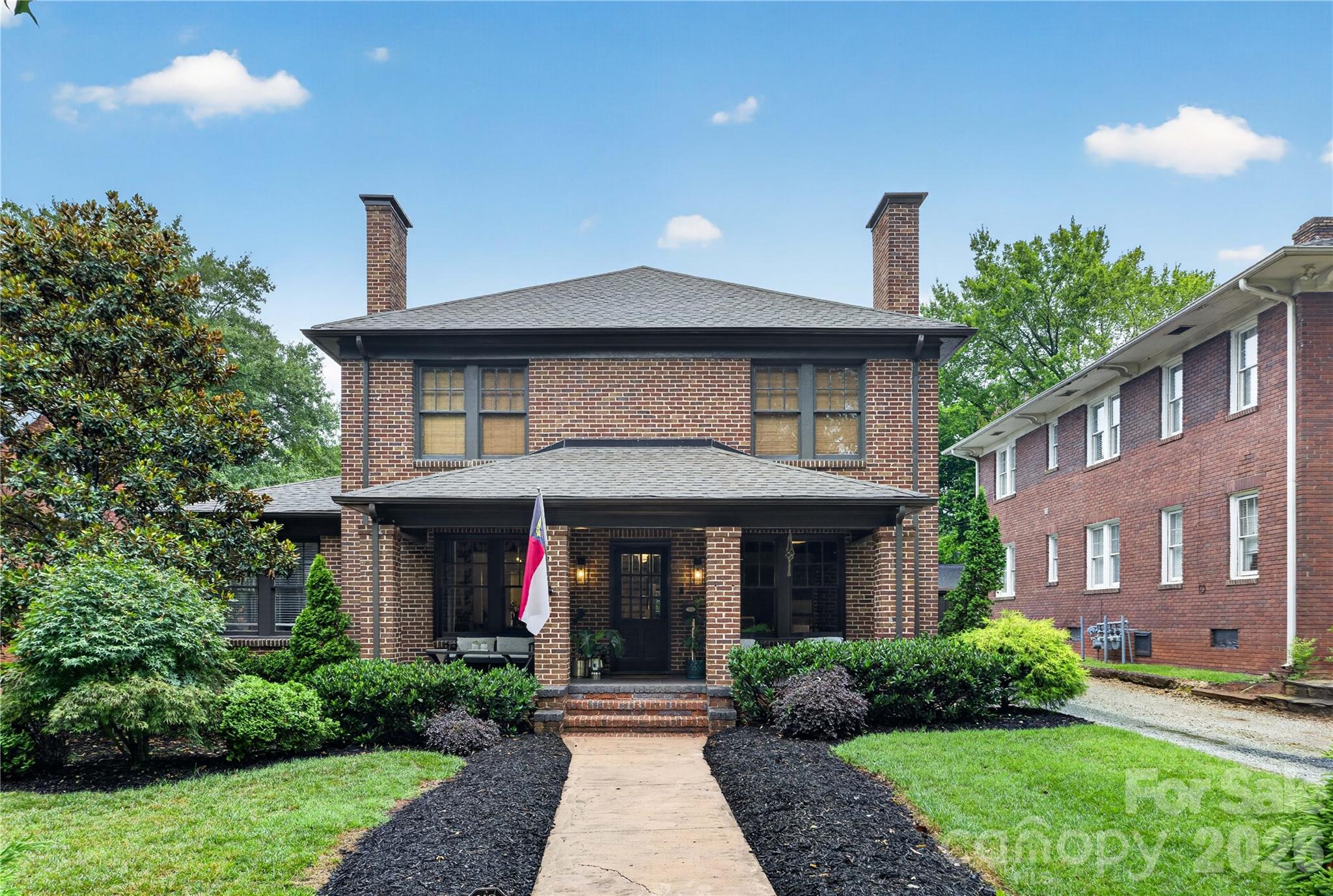 Perfectly positioned in beautiful Historic Wesley Heights, this timeless full-brick home offers the ideal blend of historic charm, modern updates, and an unbeatable walkable lifestyle. Start your mornings on the inviting covered front porch, then enjoy being just a short walk from Uptown, Bank of America Stadium, local breweries, restaurants, and greenways.Inside, you’ll find spacious living areas accented by three fireplaces, beautiful architectural details, and a functional, open floor plan designed for today’s lifestyle. The main level features a private guest suite with an en suite bathroom—ideal for visitors or multigenerational living—as well as a dedicated home office perfect for remote work.Upstairs, the primary suite is a true retreat featuring a newly renovated spa-inspired en suite bathroom. Additional bedrooms offer generous space and flexibility for family or guests.Step outside to a fully fenced backyard designed for entertaining, complete with a fire pit, storage shed, and ample space to relax, garden, or play. Off-street parking adds everyday convenience in this sought-after in-town location.Combining classic brick construction, thoughtful updates, exceptional outdoor living, and a prime location, this is a rare opportunity to own a truly special Charlotte home.