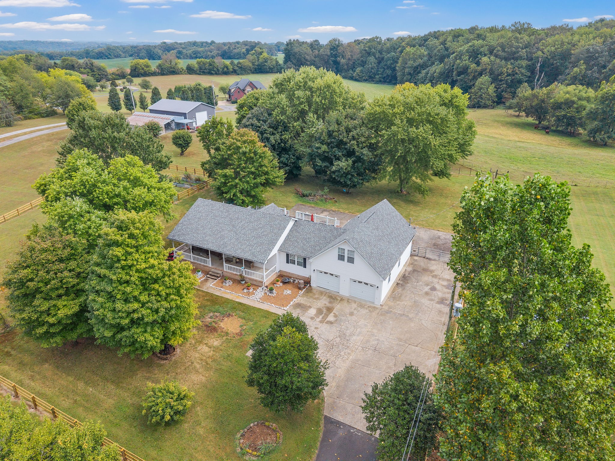 If you are looking for a 2.5 acre mini farm in Adams, Tennessee, look no further! Welcome to this charming farmhouse set on 2.5 acres in desirable Adams—a rare opportunity to enjoy country living with modern comforts. Bring your horses to the newly fenced yard and soak in the peace and privacy of wide-open spaces while still feeling connected to nature through brand-new picture windows. This spacious home features 3 bedrooms plus versatile flex spaces, perfect for additional bedrooms, a home office, or a hobby room. A large bonus room with its own bedroom and full bathroom makes an ideal setup for in-laws, guests, or multi-generational living. Enjoy an open-concept layout that blends farmhouse charm with modern convenience, along with a new roof, and newer AC and hot water heater for peace of mind. Whether you’re dreaming of quiet mornings on the porch, room for your animals, or space for a growing family, this property has it all! Don’t miss your chance to experience country living in one of the county’s most desirable areas!