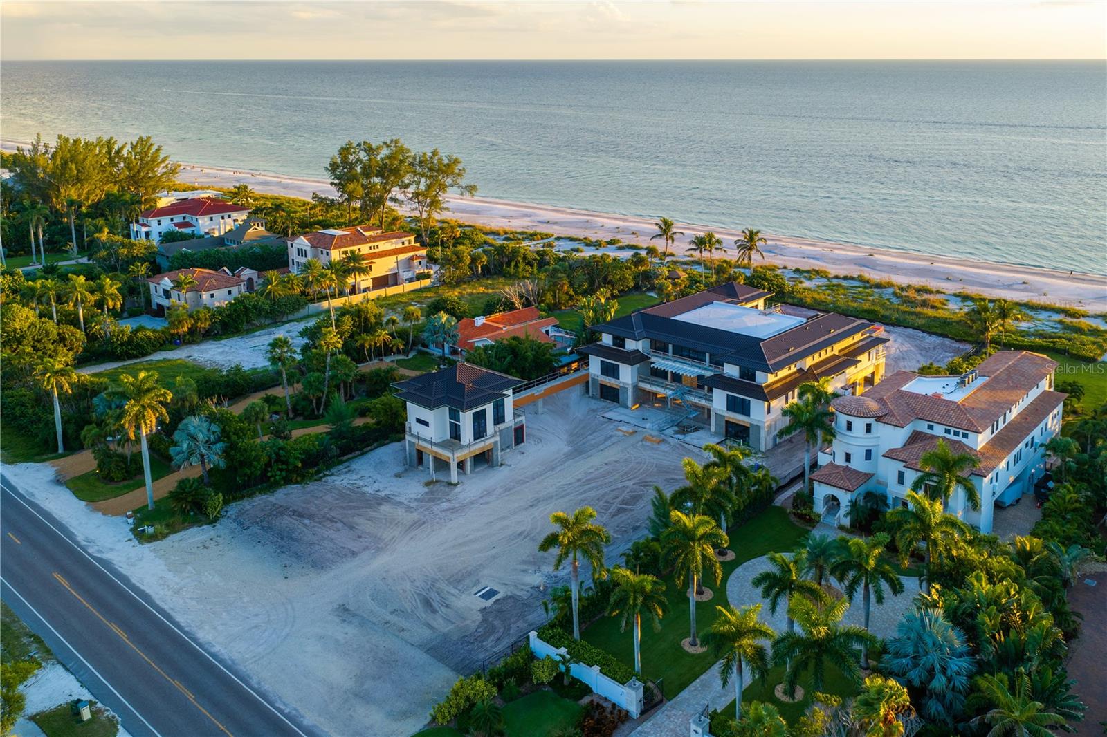 Under Construction. PRE-AUCTION: Bidder registration deadline: 5 November.Rising on nearly two private Gulf-front acres, this visionary estate is poised to become one of the most architecturally significant residences conceived on Longboat Key. Designed by internationally acclaimed Sweet Sparkman Architecture & Interiors, the sculptural home pairs bold modern form with coastal sensitivity, framing uninterrupted Gulf views from a dramatic foyer, open great room, and sweeping terraces. Dual kitchens, a temperature-controlled wine cellar, dedicated space for a private cinema, and rooftop deck elevate daily living and grand-scale entertaining, while a guest house and pool house extend privacy and flexibility. Lush resort-style grounds unfold to a shimmering pool and spa. Offered at a pivotal stage of construction, the estate presents a rare chance to shape an enduring Gulf-front legacy.