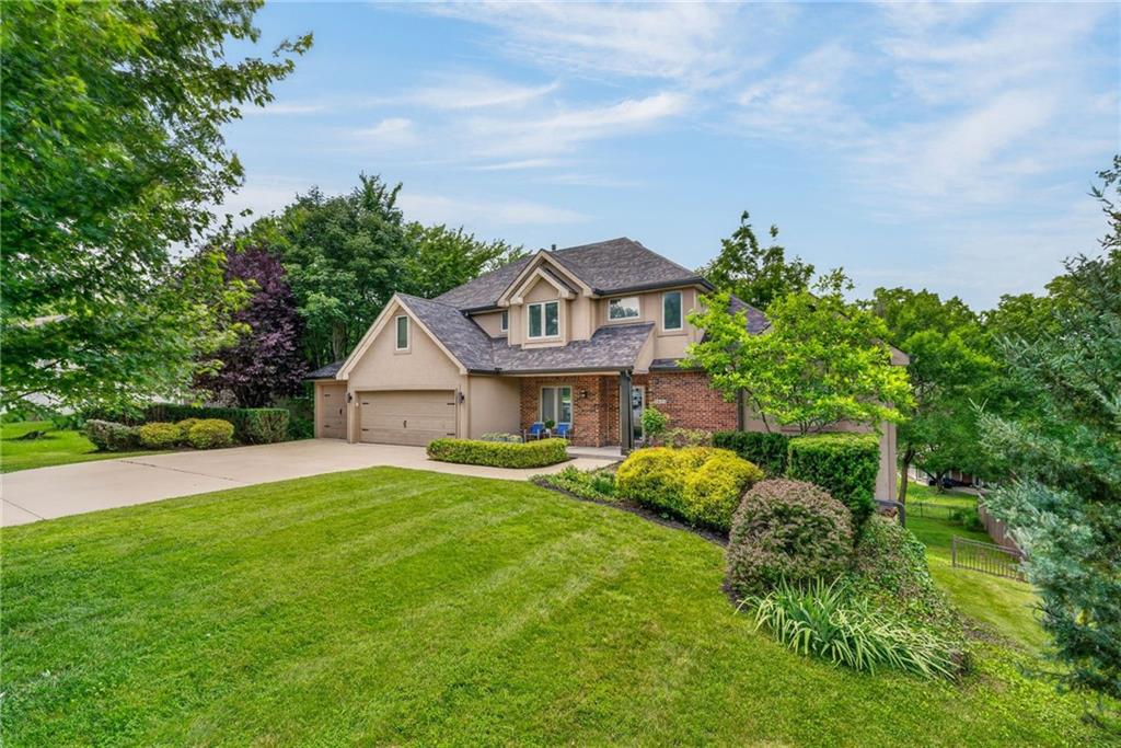 Experience Weatherby Lake Missouri with the perfect blend of comfort, elegance, and recreation in this exceptional custom built second-tier lake home with lake access and stunning sunset views. Thoughtfully designed for both everyday living and entertaining. This spacious 4-bedroom, 4.5-bath, 3 car garage residence offers an inviting floor plan with luxury finishes throughout.The main-level primary suite serves as a private retreat, featuring vaulted ceilings, and a beautifully updated spa-inspired bath designed for relaxation. The heart of the home flows seamlessly to an expanded lower level outdoor living space, a custom firepit, outdoor television, and hot tub create the ultimate setting for relaxing or gathering with family and friends while enjoying spectacular evening sunsets.The impressive walkout lower level boasts soaring 14-foot ceilings, a spacious media area, Projector TV, game area, epoxy floors, private guest bedroom, Full bath, stylish bar/or small kitchen, library space, and a unique exercise room or other living space is located within the SUSPENDED GARAGE SPACE. Upstairs, a versatile loft provides additional living space, complemented by a private en-suite bedroom and an additional bedroom and bath.Outside, the fenced backyard offers privacy and room to play, while the home's coveted location places you just moments from lake access, a neighborhood park, playground, sand volleyball court, and popular concert venue—making it easy to enjoy an active, vibrant lifestyle year-round. C-point across the lake offers a beach for fun swiming and relaxing.This is more than a home—it's a destination where lake living, luxury amenities, and unforgettable sunsets come together in one exceptional property. Love where you live & play.  A must see.