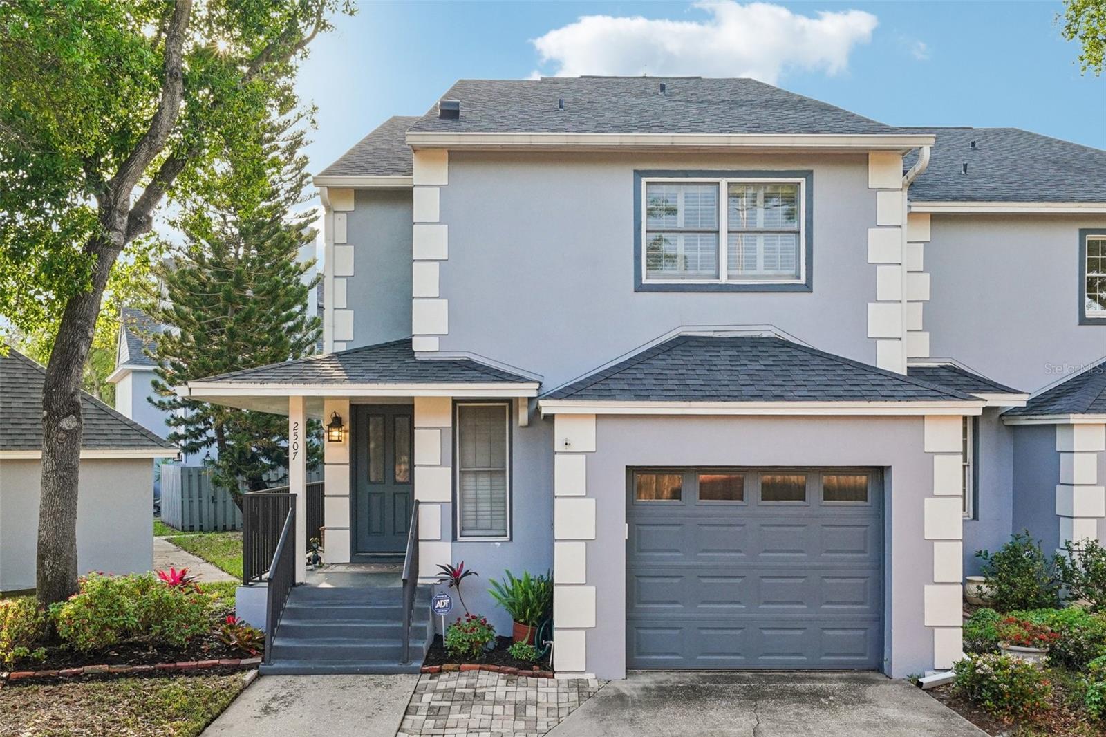 Under contract-accepting backup offers. Perfectly positioned in a prime location just moments from the scenic views of Bayshore Blvd and the vibrant energy of Hyde Park, this sophisticated residence offers the seamless feel of a townhome with the effortless maintenance of a condo. Located within the highly coveted Mitchell, Wilson, and Plant school district, this home provides both an elite location and peace of mind, as the property has no history of past flooding or water intrusion.  Situated within a secure gated community complete with a sparkling pool. Every inch of this three-bedroom, two-and-a-half-bath home has undergone meticulous reimagining, starting with a brand-new front door that opens to upscale engineered hardwood floors and a thoughtfully designed entryway featuring custom accent lighting. The heart of the home is the stunningly reconfigured kitchen, which was completely gutted to create an open peninsula layout. It boasts a custom walnut wood counter by S&W Kitchens, knurled brass and nickel hardware, and a premium granite sink set against a riveting designer backsplash. High-end appliances, including a new refrigerator and stove, pair with a custom wood-accented ceiling and abundant new electrical outlets to create a space that is as functional as it is beautiful.The living and dining areas are defined by elegant wainscoting and a custom-installed half-display wall, while specialized tilted spotlighting throughout the main floor and master bedroom ensures your artwork is always the center of attention. Practicality meets luxury with a newly created storage closet tucked under the stairs and a renovated powder room featuring wainscoting, a new vanity, and upgraded fixtures. For peace of mind, the property also includes a premium water softener system installed in December 2025.The transition to the second floor is equally impressive, featuring refinished wood stairs with a crisp white banister and a richly stained handrail, all illuminated by new overhead lighting. The owner’s suite serves as a private sanctuary, highlighted by a fully gutted and renovated bathroom that features a full glass-enclosure shower, designer sconces, and new flooring from top to bottom. Each bedroom in the home has been updated with new ceiling fans and integrated ceiling lights, ensuring a bright and modern atmosphere in every room. Outside, the private fenced-in patio and a one-car garage provide the perfect finishing touches to this turnkey property, which has been freshly painted and upgraded with new doors and hardware throughout.