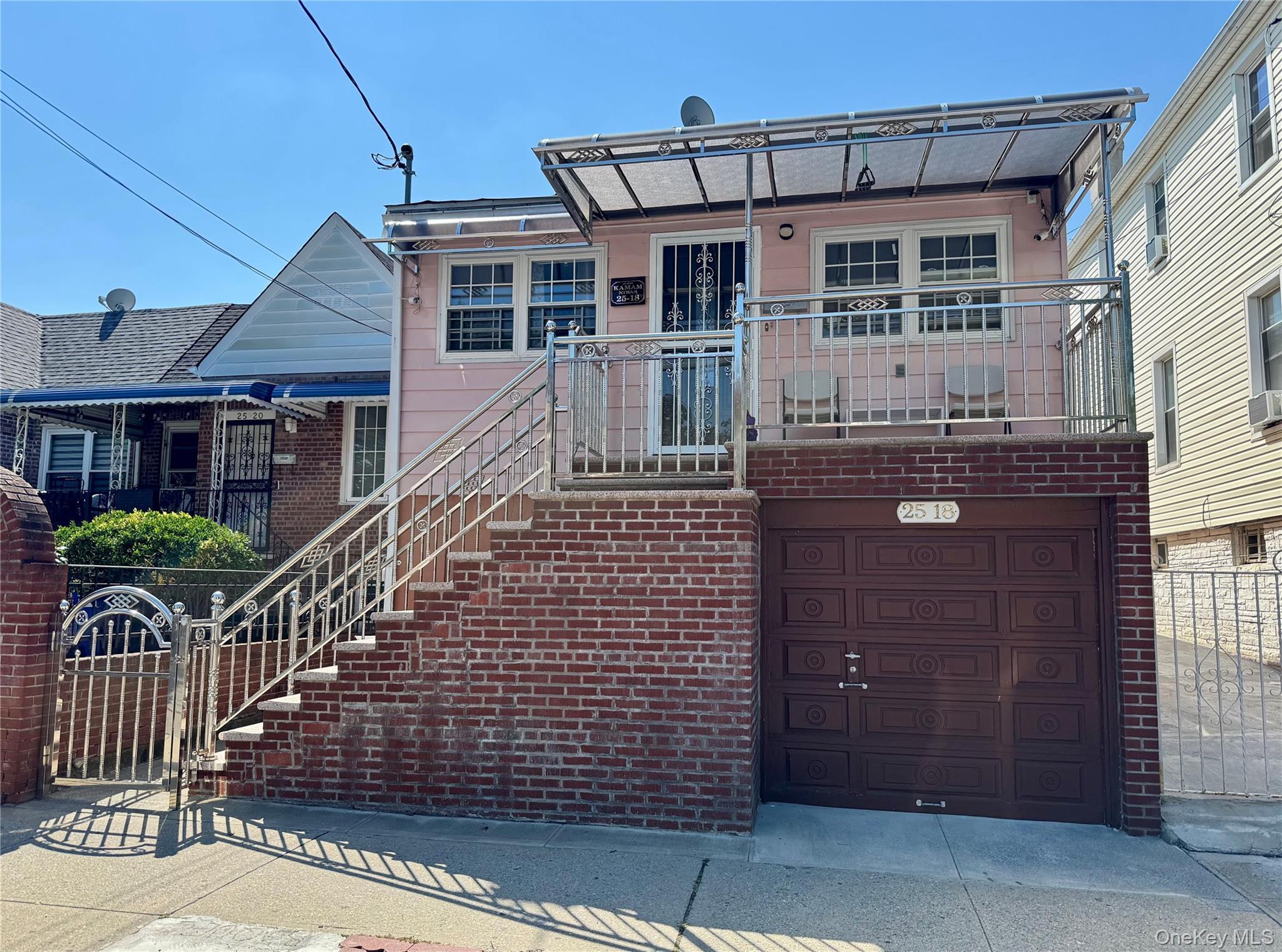 Welcome to this fully updated legal one-family home located on the border of Jackson Heights and East Elmhurst. Offering a flexible layout and excellent overall condition, this home provides plenty of space for comfortable everyday living. The walk-in level features a garage, storage room, open living room, two additional rooms, and a full bathroom. The main floor includes a living room/dining room, renovated kitchen, primary bedroom with private bathroom, two additional bedrooms, and another bathroom. A rear 12’ x 16’ extension provides valuable additional space. Conveniently located near Astoria Boulevard and the Q33 and Q47 bus lines, this move-in-ready home offers generous space, flexibility, and easy access to both Jackson Heights and East Elmhurst. Property is being sold in its current configuration. Rear extension is not represented as legal. Buyer should independently verify all information regarding property use, configuration, permits and property records.