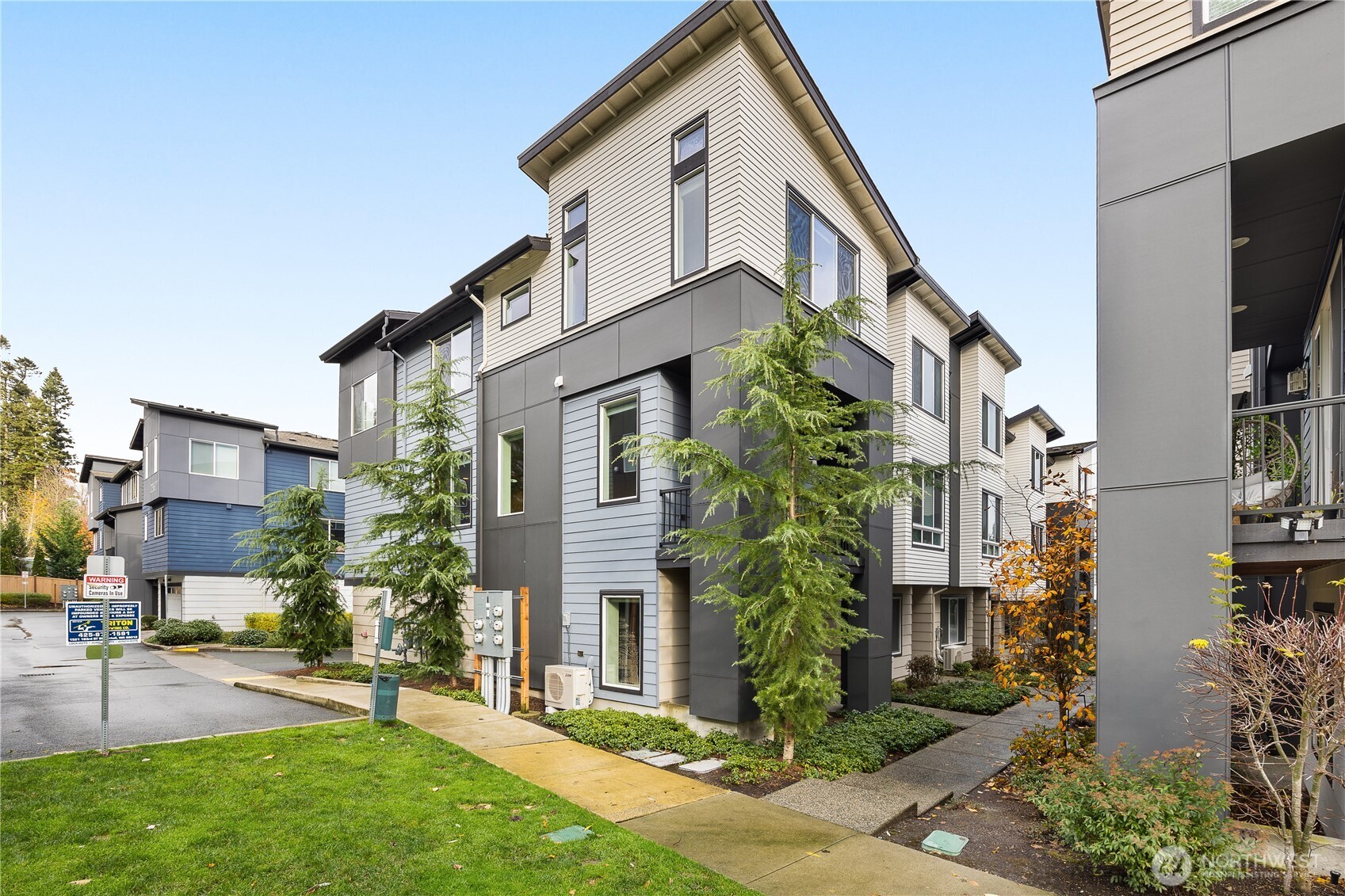 Welcome Home to this 3 Story, 4 bedroom, 3.5 bath end unit townhome in desirable Urbane Village. This home is packed with features, including 2 suites. The primary bedroom on the 3rd floor with luxurious bathroom & large walk in closet. The second suite is on the ground floor, also with full bath, perfect for co-living. Glorious Kitchen with gas range & double oven, stainless steel appliances, huge center island, all with beautiful granite countertops. Storage galore, tons of cabinets, closets & even a walk in pantry. Large separate laundry room close to the bedrooms. Generous open concept living, modern gas fireplace, guest bath & covered deck, with a gas BBQ connection. Positioned directly next to green space, providing views of nature.