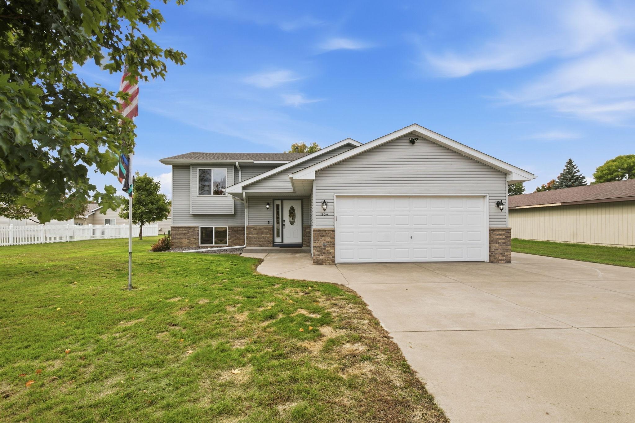 Welcome to 1104 E Able Street in desirable St. Joe!  This 3-bedroom, 2 bath bi-level home has the comfort and features you are looking for.  The upper level boasts a large living room and kitchen area that opens up to the brand-new maintenance free deck. There are 2 bedrooms on the upper level and a full bathroom.  The lower level will impress with an updated shiplap wall with TV mount and electric fireplace.  There is a bar for entertaining along with bar stools and mini fridge ready for your friends and family to gather.  An additional bedroom and full bathroom with tile surround complete the lower level.  The attached 2 stall, heated garage is perfect for the upcoming cold months.  There is an additional parking pad alongside the garage for added outdoor space.  Other amenities include in-ground sprinkler with sandpoint well, updated fixtures and a garden shed for extra storage.