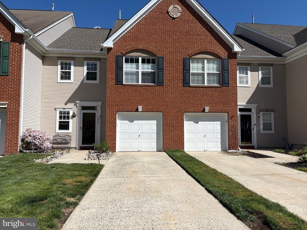 Pictures coming soon! Don’t miss this spacious 2-bedroom, 2.5-bath townhome tucked away in the highly sought-after Medford Mews community. Surrounded by beautiful, wooded scenery, this home offers the perfect blend of comfort and convenience and peace of mind with a brand mew heater, beautifully updated bathrooms and a roof backed by a 50-year warranty. The inviting eat-in kitchen flows into a bright and airy living room with dramatic two-story ceilings and abundant natural light year-round. Upstairs, the primary suite boasts a luxurious soaking tub, stall shower, and generous closet space, while the second bedroom, full hall bath, and laundry area provide everyday ease. Enjoy all that Medford Mews has to offer, including picturesque landscaping, a playground, and courts for pickleball and basketball. A rare opportunity to enjoy low maintenance living in a welcoming community setting with major updates already completed.  Home is being sold "as is".