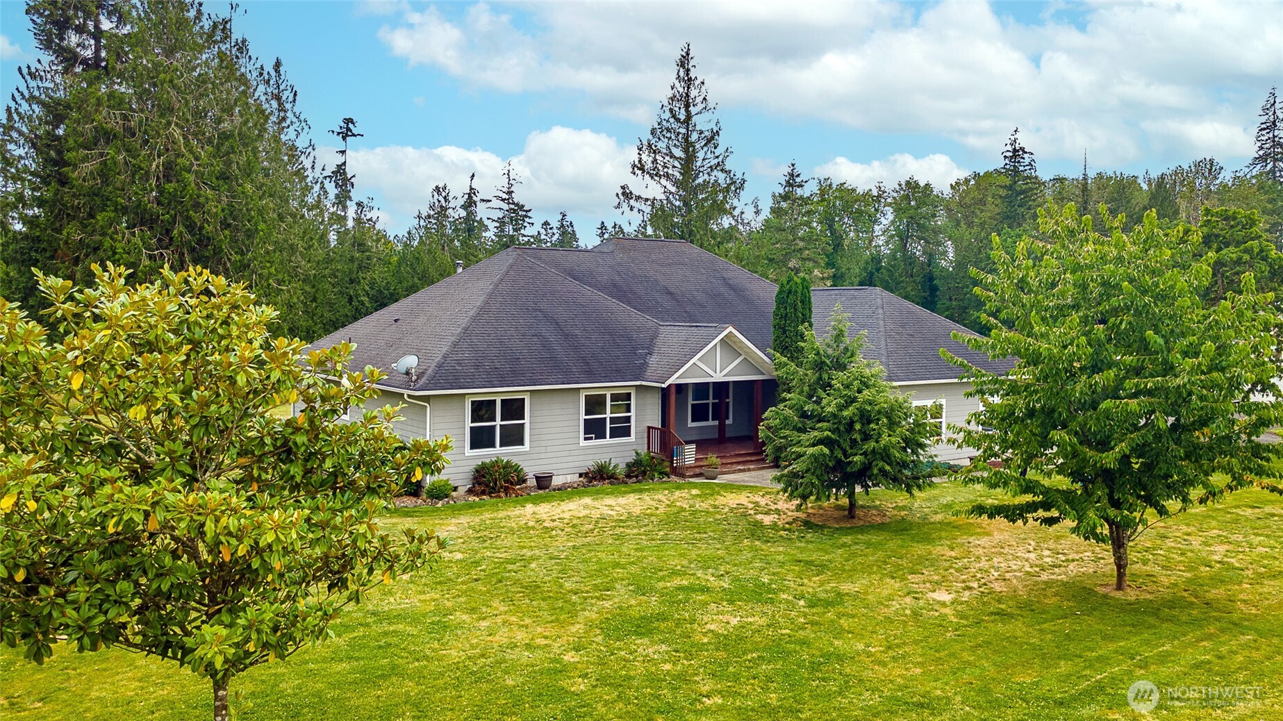 Beautiful 3-bedroom home w/bonus room & office/den, perfectly set back from the road for privacy & a peaceful setting on this expansive 21-acre property. Hayfields & fenced pastures stretch out in front, while the forest frames the back of the home creating a serene country atmosphere that feels worlds away yet fully functional for modern living. Kitchen features custom-built premium DeWils cabinetry w/solid wood construction, soft-close drawers, pullout shelves, & under-cabinet lighting. A gas range ensures precise, dependable cooking even during power outages. Solid hardwood flooring flows through the main living spaces & a wood stove adds cozy charm & extra heat source to the open kitchen/dining/living area w/easy access to a deck & patio. Primary suite includes a private deck for morning coffee or evening relaxation. Spacious primary bath offers soaker tub & beautifully tiled shower. Outdoors, the property shines w/a mature orchard of pear, apple, & cherry trees, plus established blueberries, strawberries, & grapevines. Fully fenced garden keeps animals out giving you a perfect space to grow vegetables/flowers. Large shop provides endless possibilities. Enjoy outdoor entertaining on a spacious patio or gather around the firepit under the stars. Need to work from home? High-speed fiber optic internet gives you the flexibility to stay connected while enjoying the tranquility of country living. Come & experience everything this exceptional property has to offer!