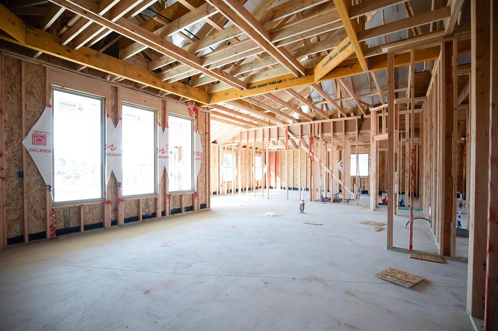 This Hazel A2 floor plan has a total of 2,095 Sqft for living space, including 1,900 Sqft of indoor living and 220 Sqft of outdoor living that features a wood-burning fireplace, a gas line, and a TV hookup! This immaculate home offers 4 bedrooms, 2 full bathrooms, covered patios, a utility room, and a 3-car garage with an in-ground storm shelter installed. The great room presents a beautiful coffered ceiling with a ceiling fan, a gorgeous corner gas fireplace with our stacked stone detail, large 7’ windows, rocker switches throughout, and elegant wood-look tile. The high-end kitchen has stainless-steel appliances, including a 5-burner cooktop, decorative tile backsplash, custom-built cabinets to the ceiling with under cabinet lighting and cabinet hardware installed throughout, a large corner pantry, 3 CM countertops, more wood look tile, stunning pendant lighting, and an oversized center island that holds a spacious sink, a dishwasher, and a trash can pullout. The primary suite spotlights a sloped ceiling detail with a ceiling fan, windows, and our cozy carpet finish. The spa-like prime bath has a free-standing tub, a dual sink vanity with framed mirrors, 3 CM countertops, a European walk-in shower, a private water closet, and a huge walk-in closet with horizontal and vertical storage opportunities. Secondary bedrooms feature high ceilings with ceiling fans, sizeable closets, windows, and carpeted flooring. Other amenities for this energy efficient home include a tankless water heater, a fresh air ventilation system, R-44 and R-15 insulation, and so much MORE!